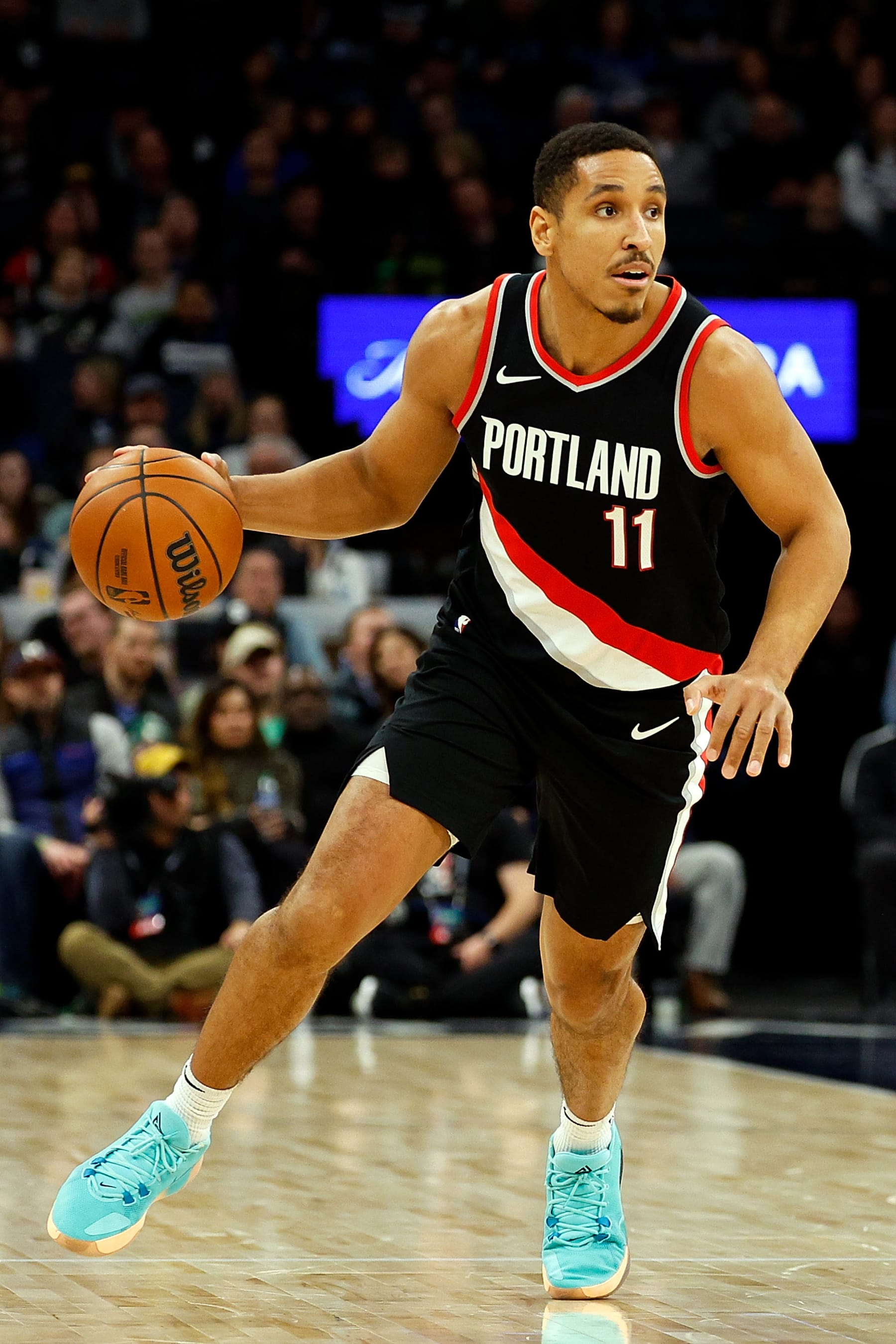 MINNEAPOLIS, MINNESOTA - JANUARY 12: Malcolm Brogdon #11 of the Portland Trail Blazers dribbles the ball against the Minnesota Timberwolves in the third quarter at Target Center on January 12, 2024 in Minneapolis, Minnesota. The Timberwolves defeated the Trail Blazers 116-93. NOTE TO USER: User expressly acknowledges and agrees that, by downloading and or using this photograph, User is consenting to the terms and conditions of the Getty Images License Agreement. (Photo by David Berding/Getty Images)