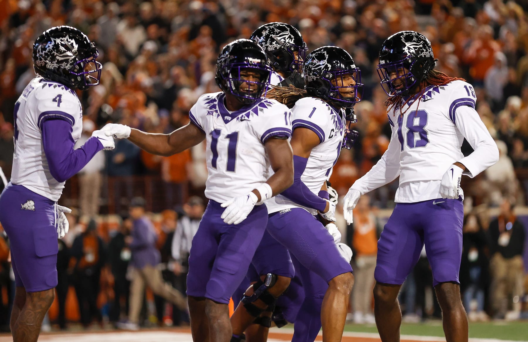 AUSTIN, TEXAS - NOVEMBER 12: The TCU Horned Frogs celebrate after a touchdown reception by Quentin Johnston #1 in the second half at Darrell K Royal-Texas Memorial Stadium on November 12, 2022 in Austin, Texas. (Photo by Tim Warner/Getty Images)