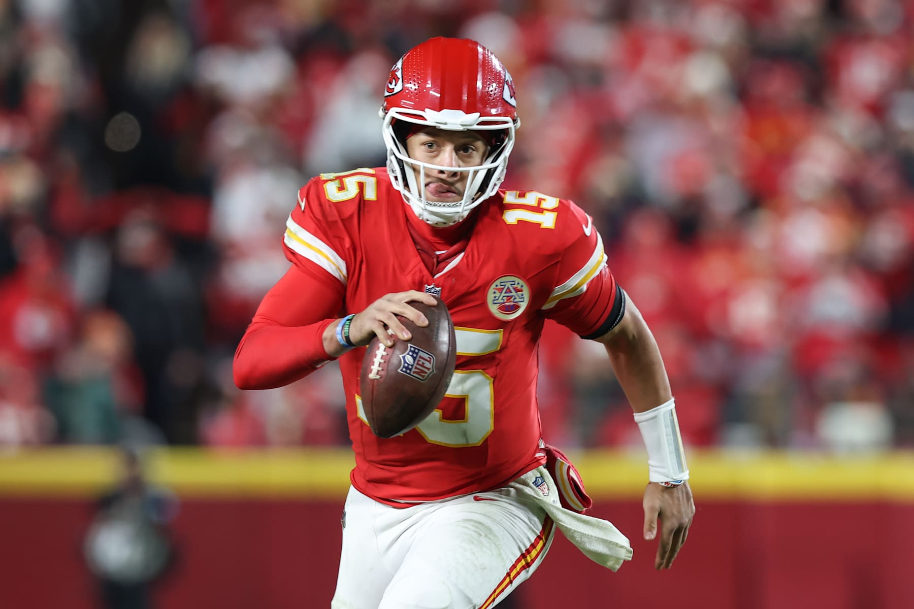 KANSAS CITY, MO - DECEMBER 08: Kansas City Chiefs quarterback Patrick Mahomes (15) scrambles for 10 yards and a first down late in the fourth quarter of an NFL game between the Los Angeles Chargers and Kansas City Chiefs on December 8, 2024 at GEHA Field at Arrowhead Stadium in Kansas City, MO. (Photo by Scott Winters/Icon Sportswire via Getty Images)