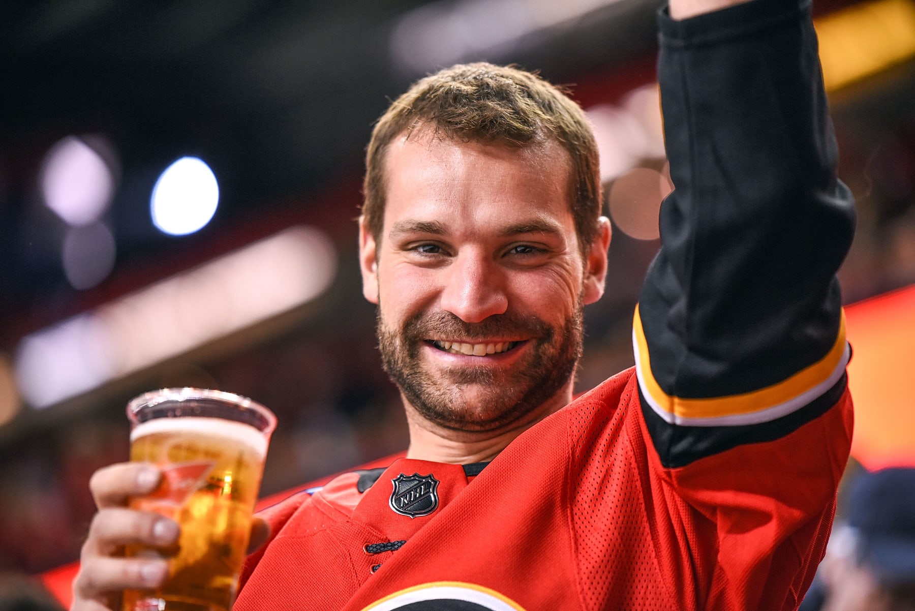 CALGARY, AB - OCTOBER 17: A Calgary Flames fan celebrates a goal by his team during the third period of an NHL game where the Calgary Flames hosted the Detroit Red Wings on October 17, 2019, at the Scotiabank Saddledome in Calgary, AB. (Photo by Brett Holmes/Icon Sportswire via Getty Images)