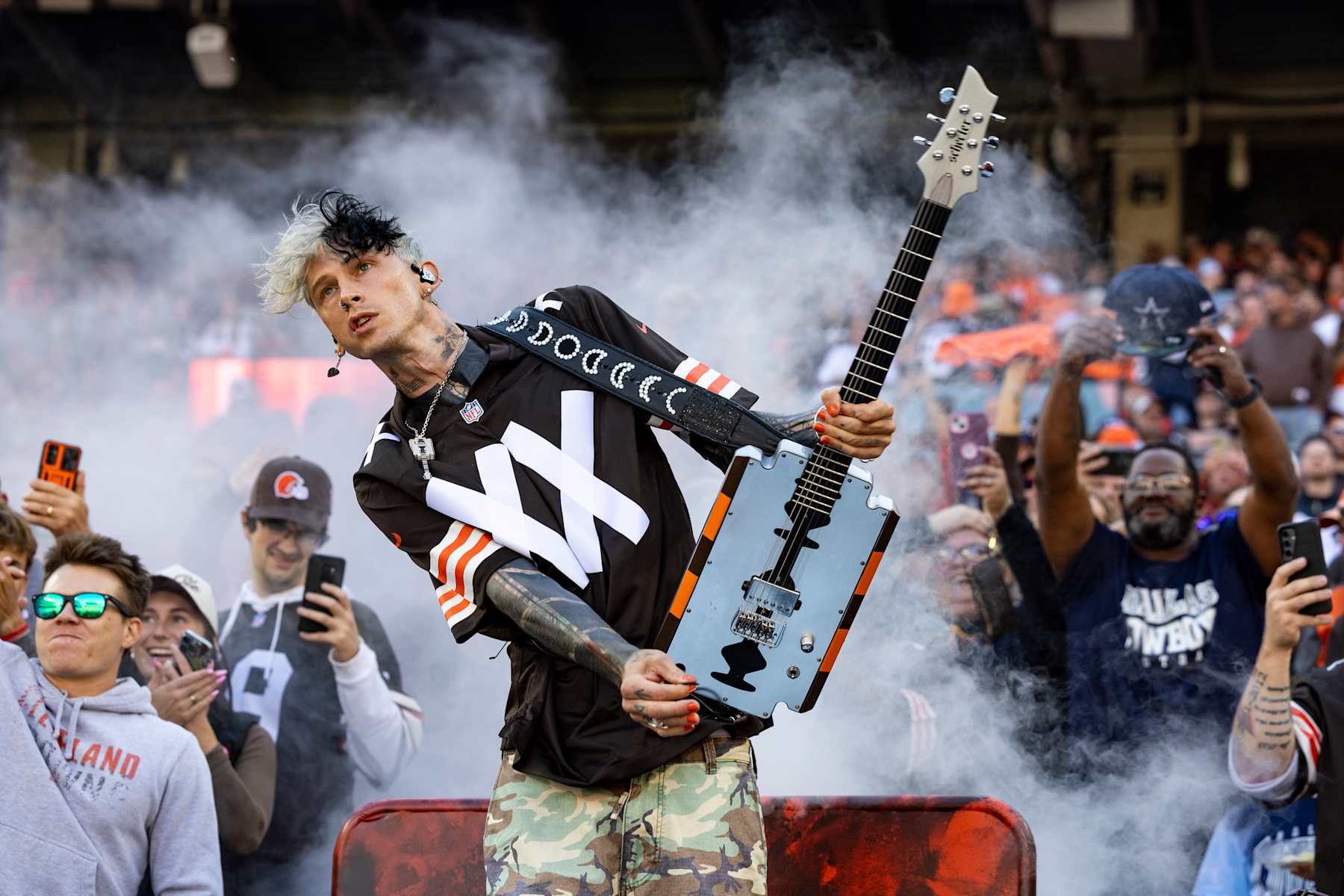CLEVELAND, OHIO - SEPTEMBER 8: Machine Gun Kelly performs before the Cleveland Browns home game against the Dallas Cowboys at Huntington Bank Field on September 8, 2024 in Cleveland, Ohio. The Cowboys defeated the Browns 33-17. (Photo by Lauren Leigh Bacho/Getty Images)