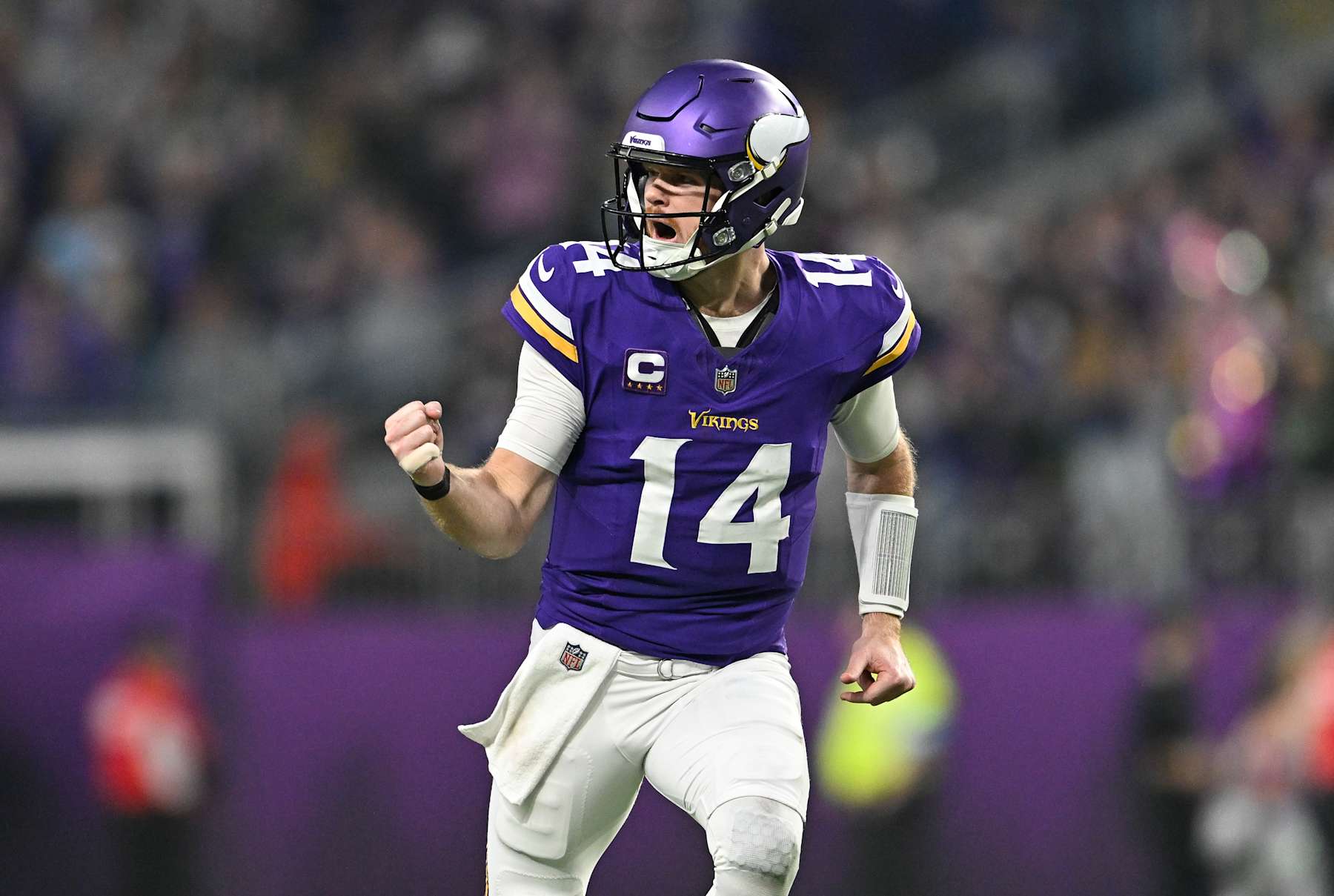 MINNEAPOLIS, MINNESOTA - DECEMBER 29: Quarterback Sam Darnold #14 of the Minnesota Vikings reacts after a throwing a touchdown pass during the second quarter against the Green Bay Packers at U.S. Bank Stadium on December 29, 2024 in Minneapolis, Minnesota. (Photo by Stephen Maturen/Getty Images)