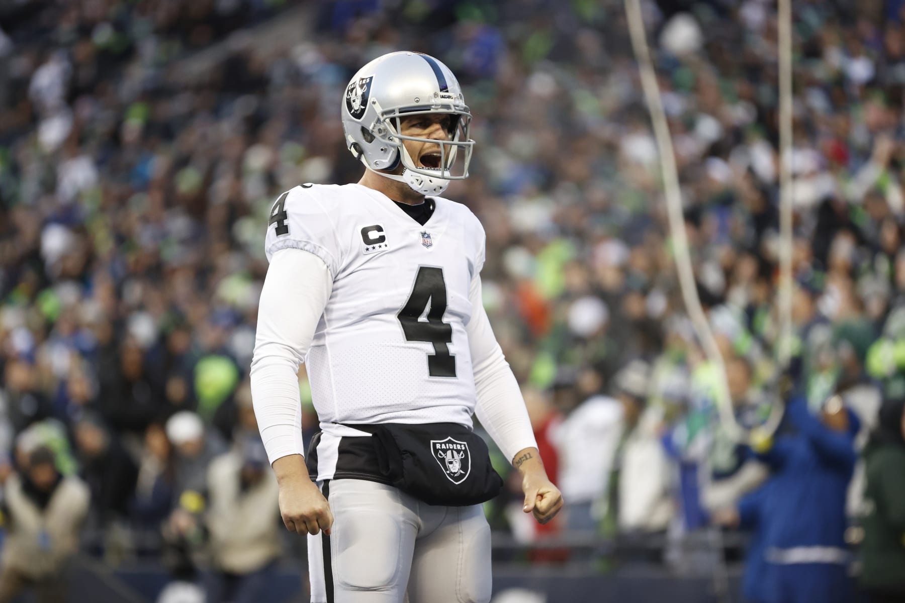 SEATTLE, WASHINGTON - NOVEMBER 27: Derek Carr #4 of the Las Vegas Raiders celebrates after scoring a touchdown in the fourth quarter against the Seattle Seahawks at Lumen Field on November 27, 2022 in Seattle, Washington. (Photo by Steph Chambers/Getty Images)