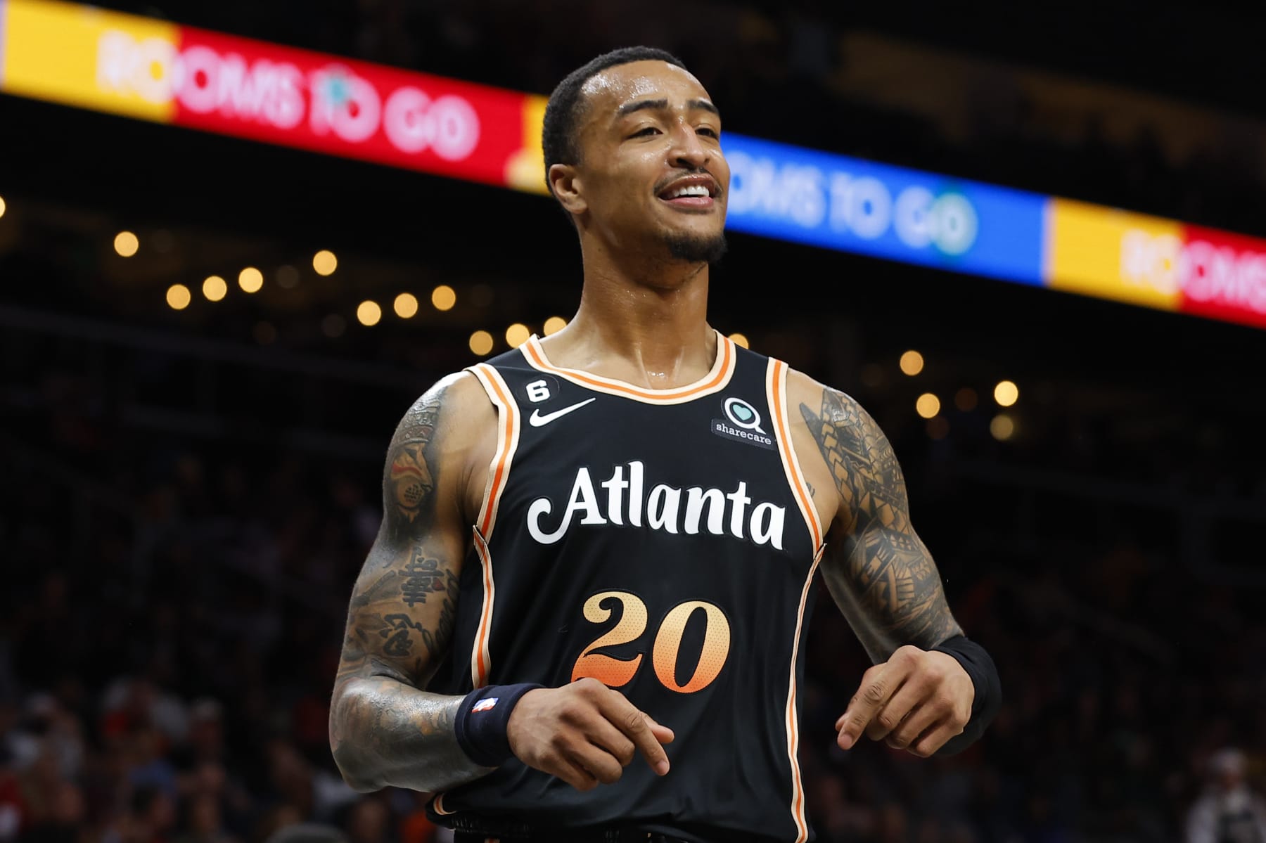 ATLANTA, GA - DECEMBER 28: John Collins #20 of the Atlanta Hawks reacts during the second half against the Brooklyn Nets at State Farm Arena on December 28, 2022 in Atlanta, Georgia. NOTE TO USER: User expressly acknowledges and agrees that, by downloading and or using this photograph, User is consenting to the terms and conditions of the Getty Images License Agreement. (Photo by Todd Kirkland/Getty Images)