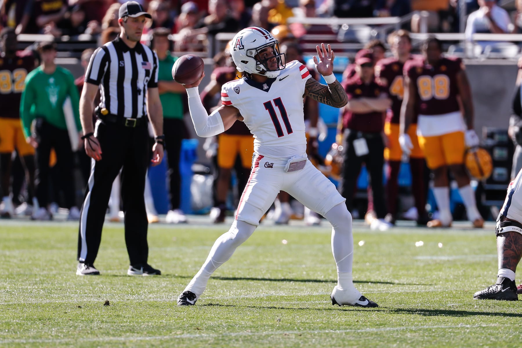 TEMPE, AZ - NOVEMBER 25:  Arizona Wildcats quarterback Noah Fifita (11) throws a pass during the college football game between the Arizona Wildcats and the Arizona State Sun Devils on November 25, 2023 at Mountain America Stadium in Tempe, Arizona. (Photo by Kevin Abele/Icon Sportswire via Getty Images)