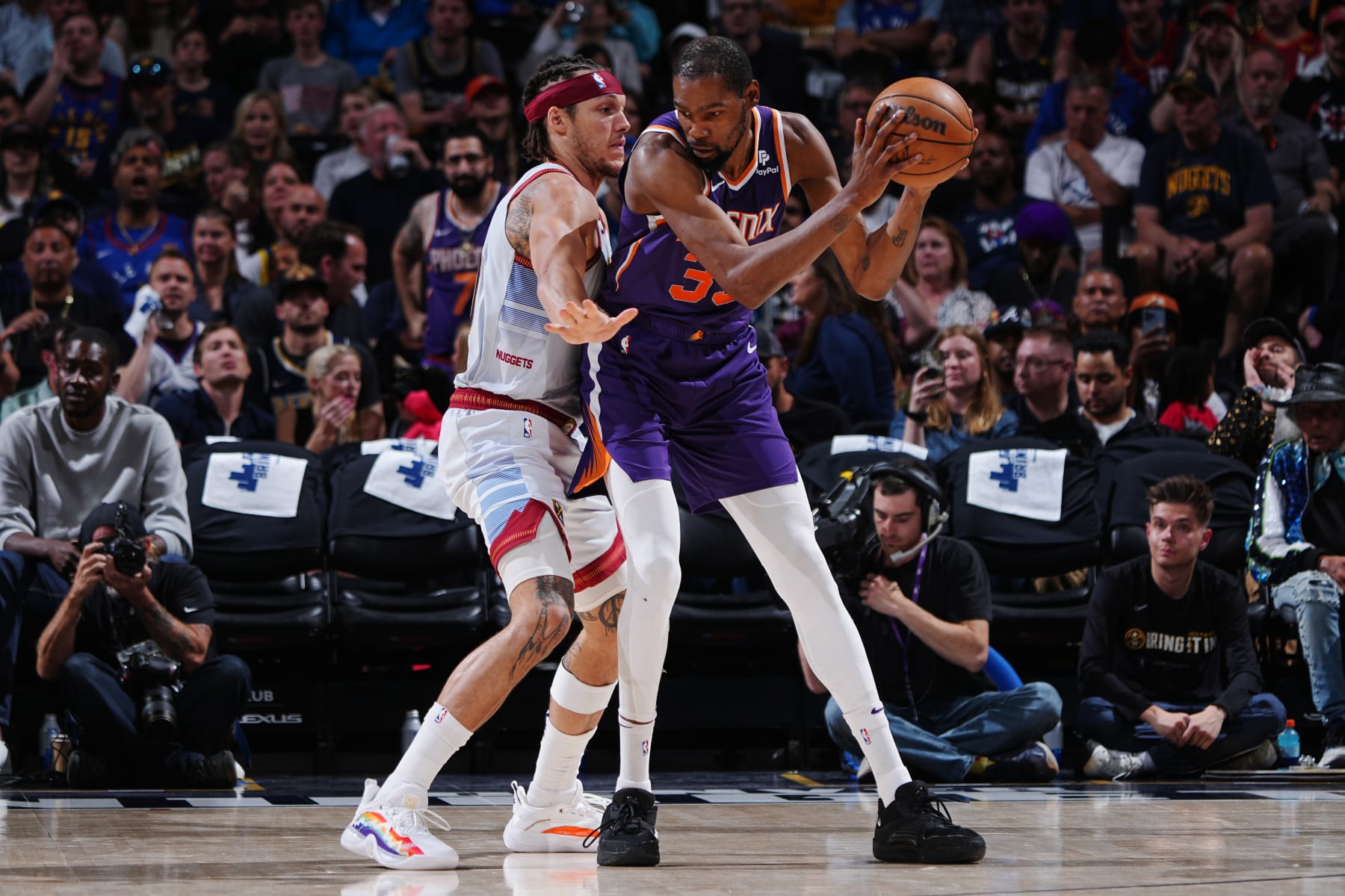 DENVER, CO - MAY 9: Kevin Durant #35 of the Phoenix Suns looks to pass the ball during Round 2 Game 5 of the Western Conference Semi-Finals 2023 NBA Playoffs against the Denver Nuggets on May 9, 2023 at the Ball Arena in Denver, Colorado. NOTE TO USER: User expressly acknowledges and agrees that, by downloading and/or using this Photograph, user is consenting to the terms and conditions of the Getty Images License Agreement. Mandatory Copyright Notice: Copyright 2023 NBAE (Photo by Garrett Ellwood/NBAE via Getty Images)