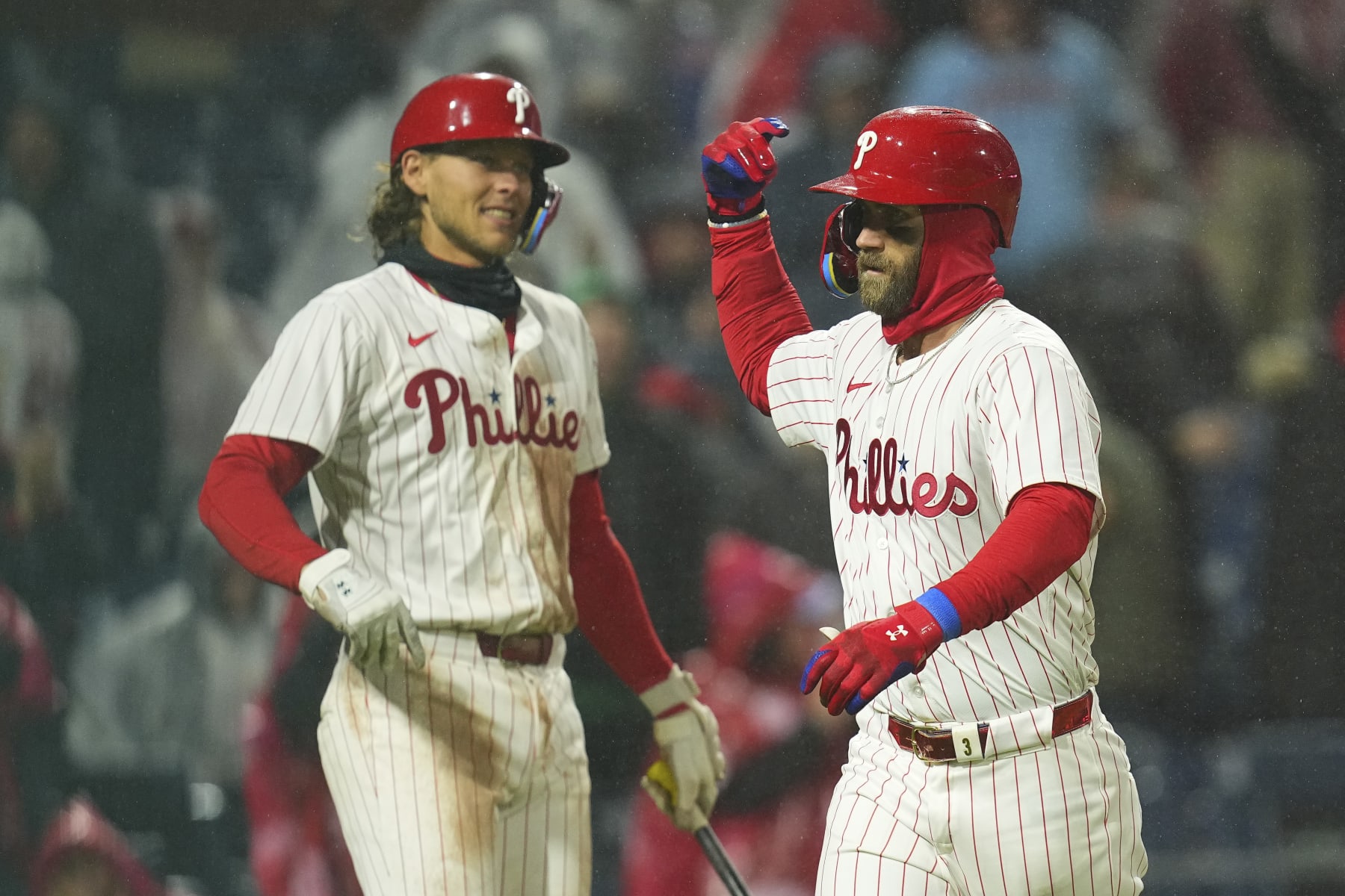 PHILADELPHIA, PENNSYLVANIA - APRIL 2: Bryce Harper #3 of the Philadelphia Phillies celebrates with Alec Bohm #28 after hitting a solo home run in the bottom of the fourth inning against the Cincinnati Reds at Citizens Bank Park on April 2, 2024 in Philadelphia, Pennsylvania. The Phillies defeated the Reds 9-4. (Photo by Mitchell Leff/Getty Images)
