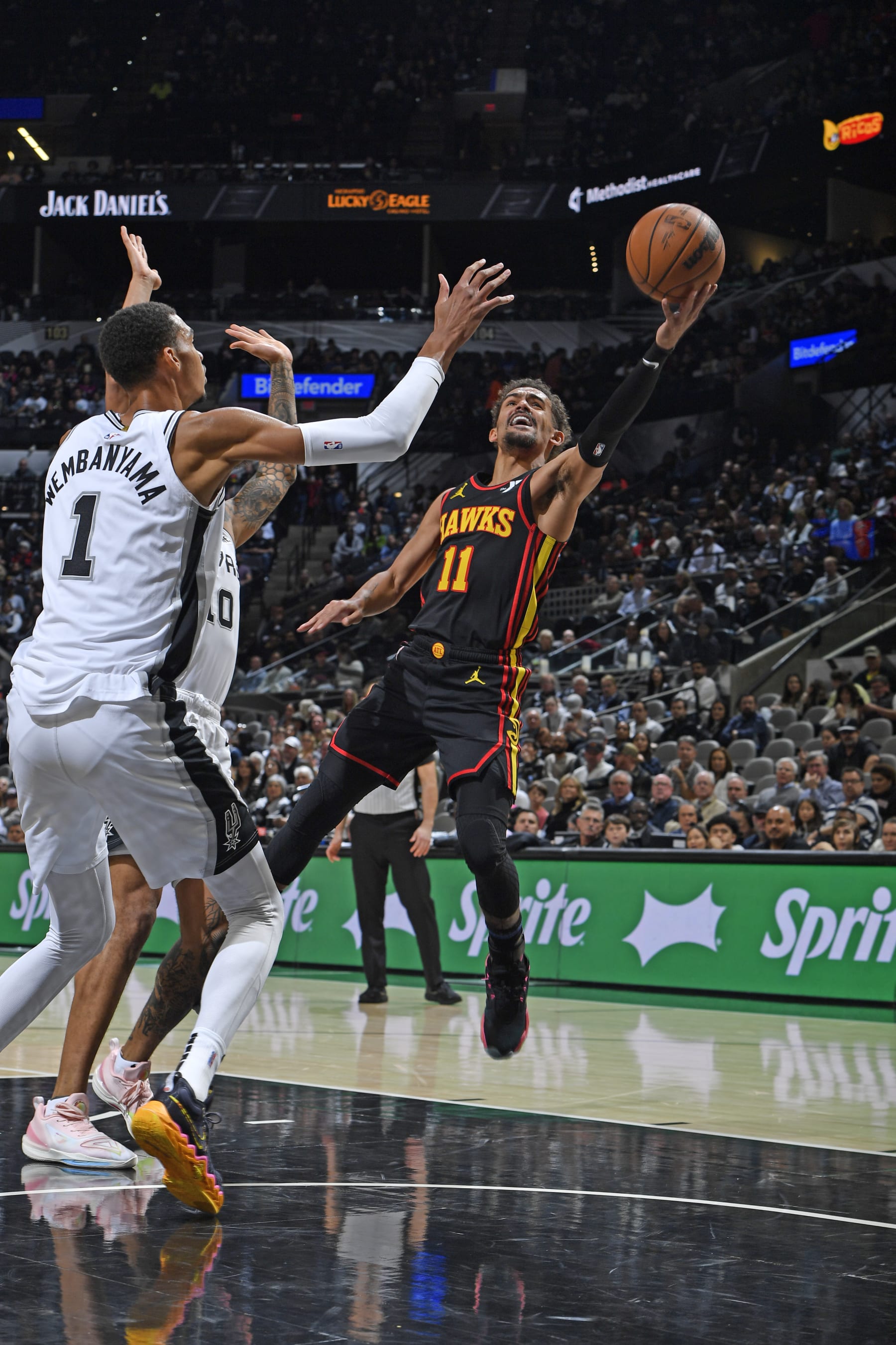 SAN ANTONIO, TX - NOVEMBER 30: Trae Young #11 of the Atlanta Hawks shoots the ball during the game against the San Antonio Spurs on November 30, 2023 at the Frost Bank Center in San Antonio, Texas. NOTE TO USER: User expressly acknowledges and agrees that, by downloading and or using this photograph, user is consenting to the terms and conditions of the Getty Images License Agreement. Mandatory Copyright Notice: Copyright 2023 NBAE (Photos by Logan Riely/NBAE via Getty Images) SAN ANTONIO, TX - NOVEMBER 30: Trae Young #11 of the Atlanta Hawks shoots the ball during the game against the San Antonio Spurs on November 30, 2023 at the Frost Bank Center in San Antonio, Texas. NOTE TO USER: User expressly acknowledges and agrees that, by downloading and or using this photograph, user is consenting to the terms and conditions of the Getty Images License Agreement. Mandatory Copyright Notice: Copyright 2023 NBAE (Photos by Logan Riely/NBAE via Getty Images)
