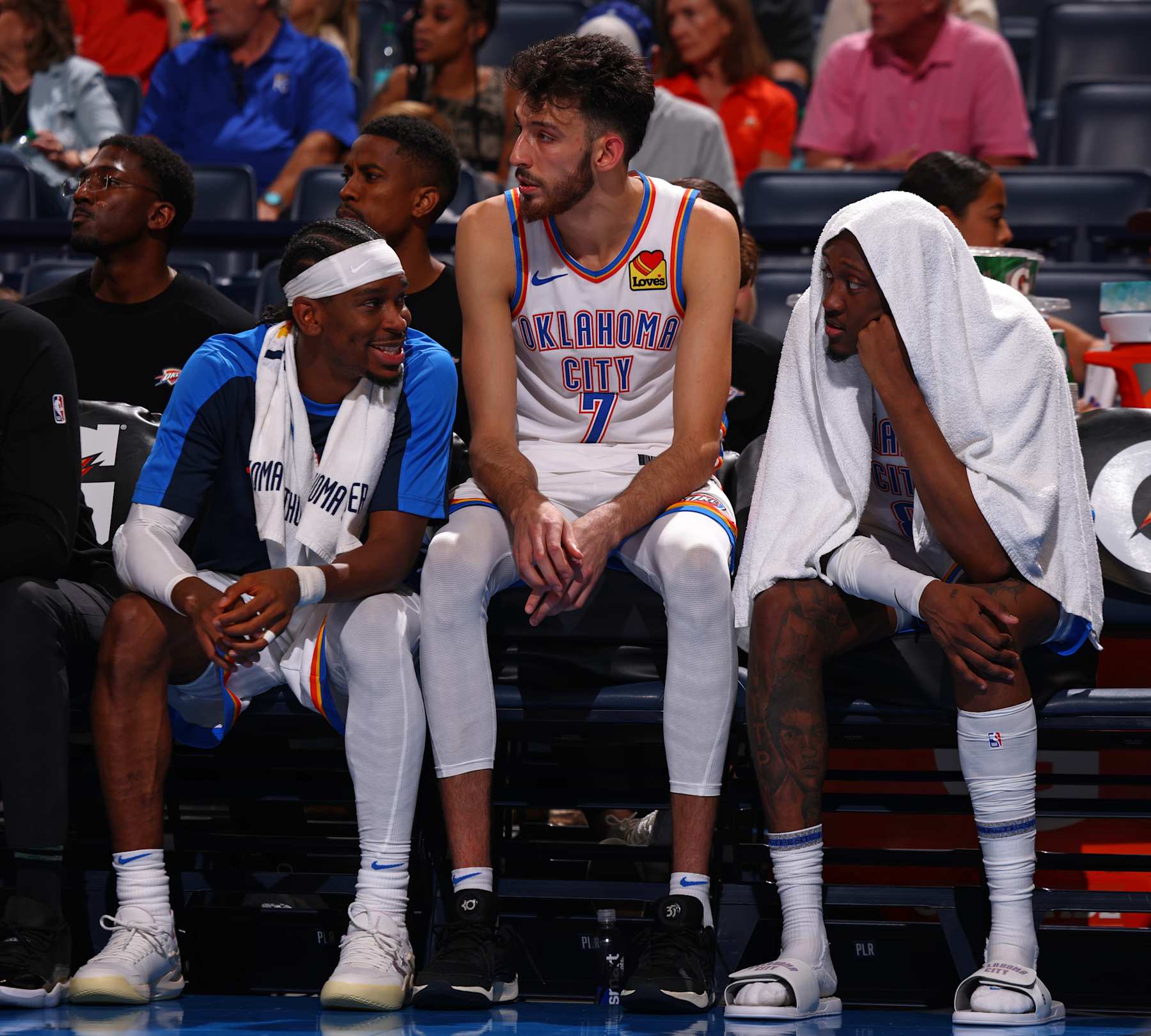 OKLAHOMA CITY, OK - OCTOBER 9: Shai Gilgeous-Alexander #2, Chet Holmgren #7, and Jalen Williams #8 of the Oklahoma City Thunder talk during the game against the Houston Rockets during a NBA pre season game on October 9, 2024 at Paycom Center in Oklahoma City, Oklahoma. NOTE TO USER: User expressly acknowledges and agrees that, by downloading and or using this photograph, User is consenting to the terms and conditions of the Getty Images License Agreement. Mandatory Copyright Notice: Copyright 2024 NBAE (Photo by Zach Beeker/NBAE via Getty Images)