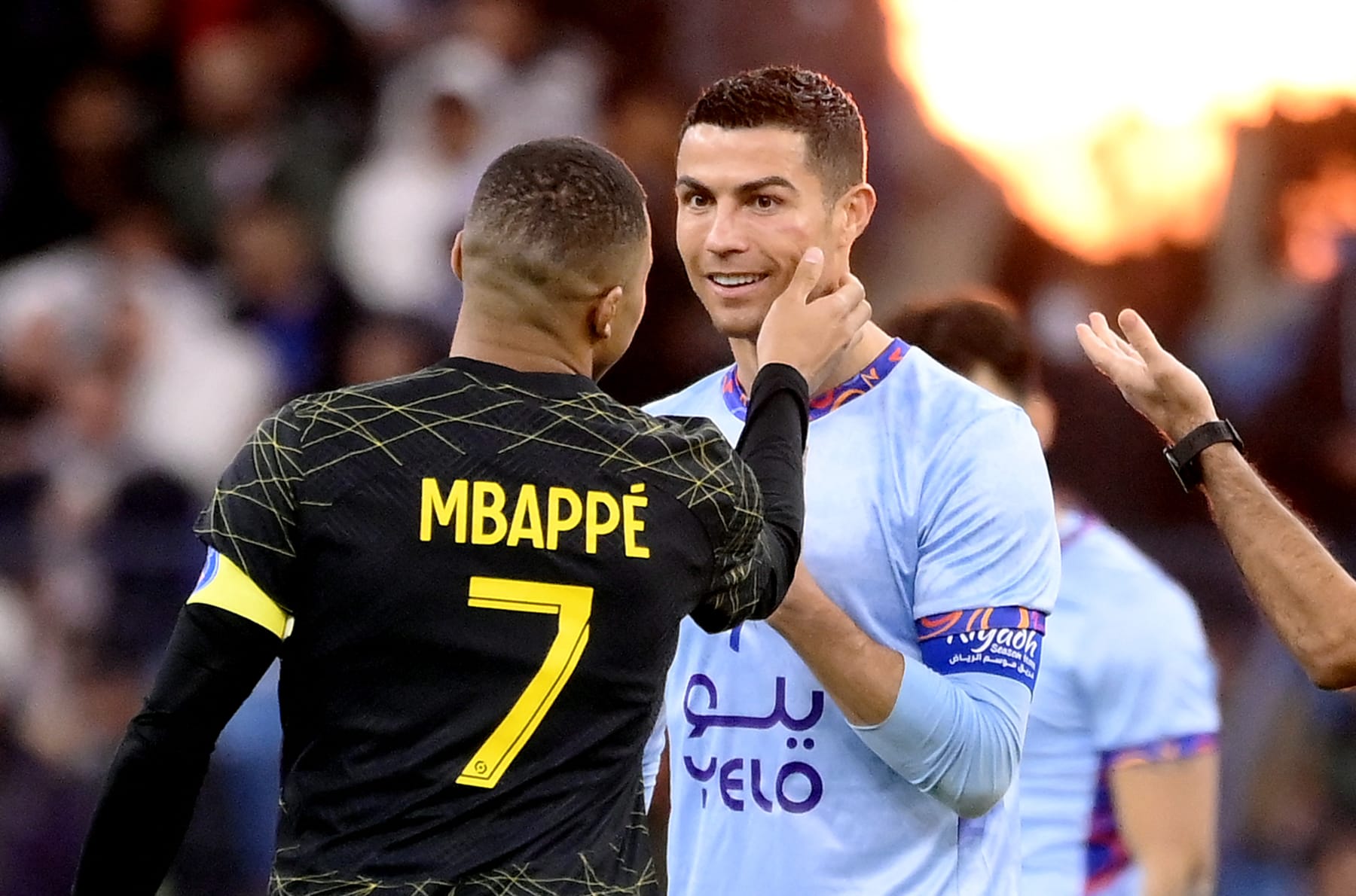 Paris Saint-Germain's French forward Kylian Mbappe (L) chats with Riyadh All-Star's Portuguese forward Cristiano Ronaldo (R) during the Riyadh Season Cup football match between the Riyadh All-Stars and Paris Saint-Germain at the King Fahd Stadium in Riyadh on January 19, 2023. (Photo by FRANCK FIFE / AFP) (Photo by FRANCK FIFE/AFP via Getty Images)
