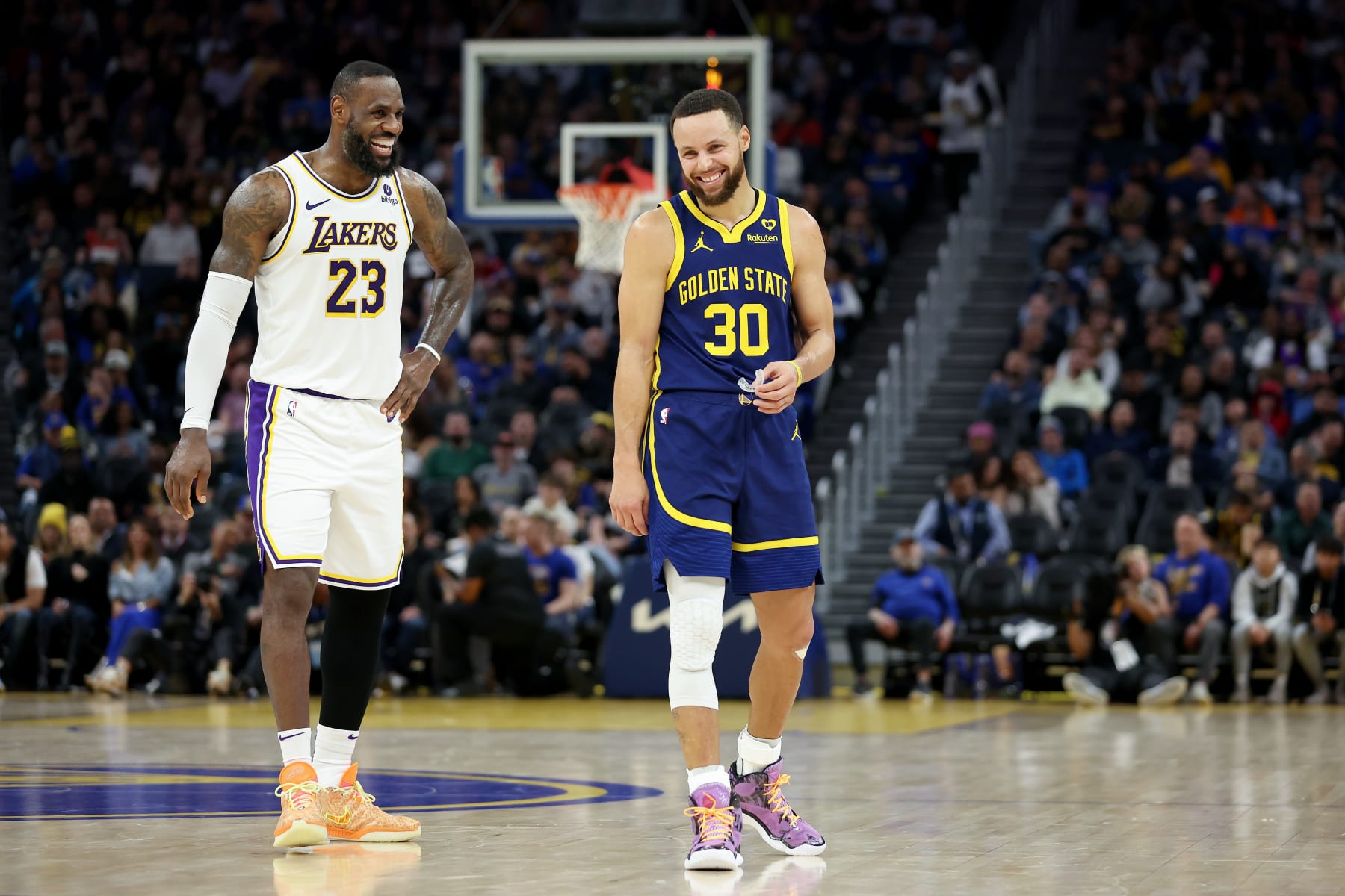 SAN FRANCISCO, CALIFORNIA - JANUARY 27: Stephen Curry #30 of the Golden State Warriors and LeBron James #23 of the Los Angeles Lakers joke around with one another during their game at Chase Center on January 27, 2024 in San Francisco, California. NOTE TO USER: User expressly acknowledges and agrees that, by downloading and or using this photograph, User is consenting to the terms and conditions of the Getty Images License Agreement.  (Photo by Ezra Shaw/Getty Images)