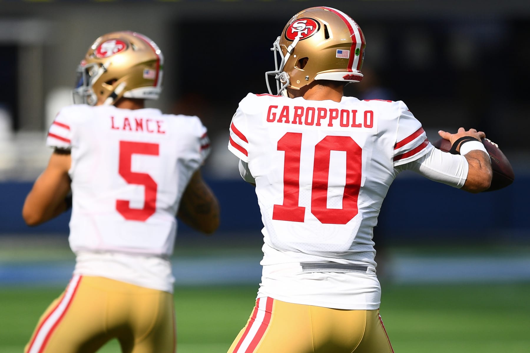 INGLEWOOD, CA - JANUARY 09: San Francisco 49ers Quarterback Jimmy Garoppolo (10) and San Francisco 49ers Quarterback Trey Lance (5) warm up before the NFL game between the San Francisco 49ers and the Los Angeles Rams on January 9, 2022, at SoFi Stadium in Inglewood, CA. (Photo by Brian Rothmuller/Icon Sportswire via Getty Images)