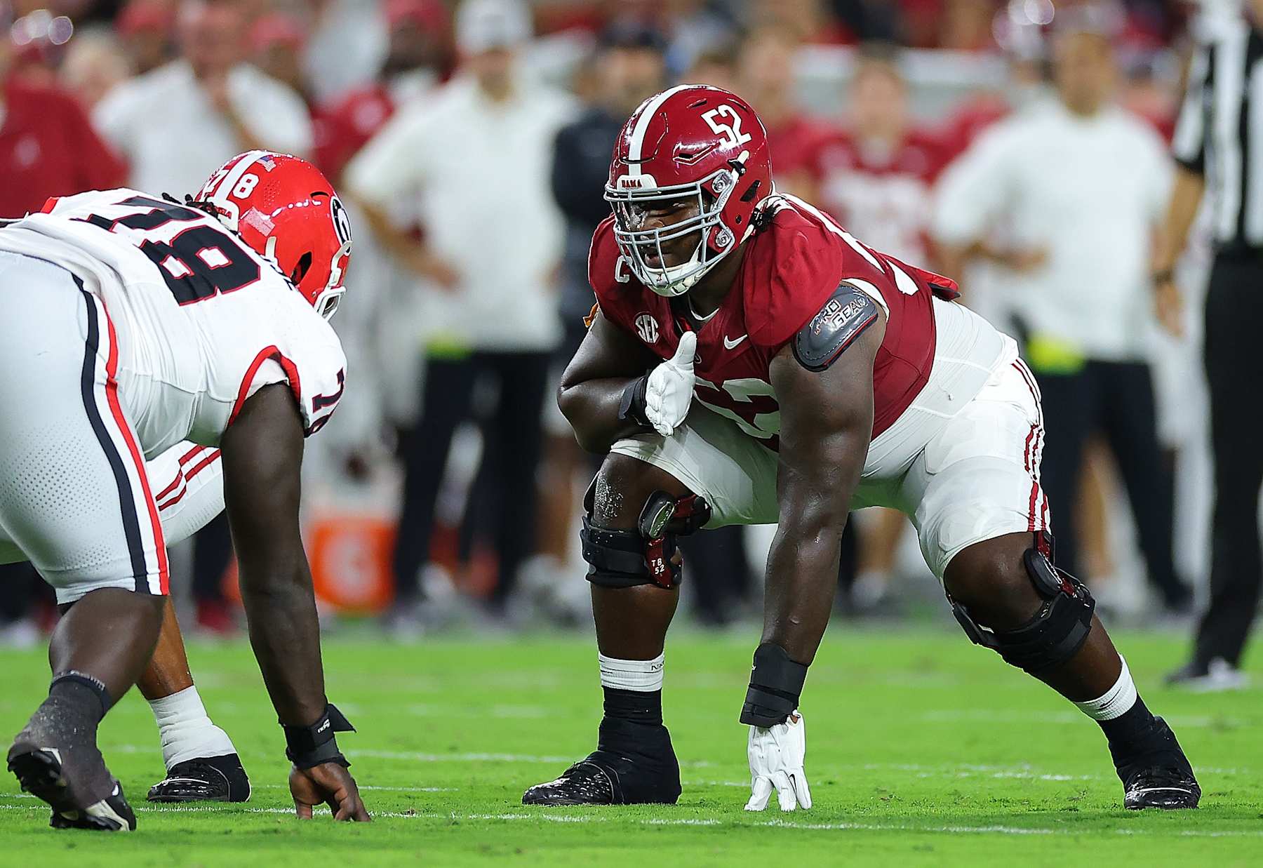TUSCALOOSA, ALABAMA - SEPTEMBER 28:  Tyler Booker #52 of the Alabama Crimson Tide lines up to block against Nazir Stackhouse #78 of the Georgia Bulldogs during the first quarter at Bryant-Denny Stadium on September 28, 2024 in Tuscaloosa, Alabama. (Photo by Kevin C. Cox/Getty Images)