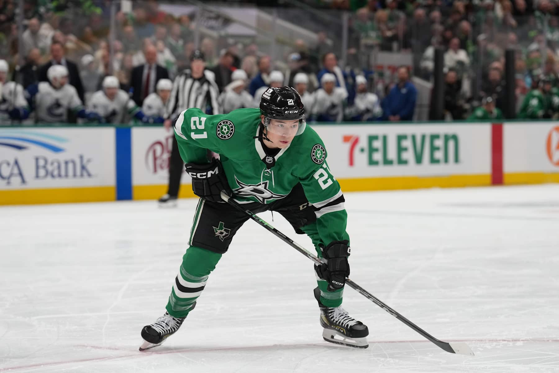 DALLAS, TX - JANUARY 31: Jason Robertson #21 of the Dallas Stars lines up against the Vancouver Canucks at the American Airlines Center on January 31, 2025 in Dallas, Texas. (Photo by Glenn James/NHLI via Getty Images)