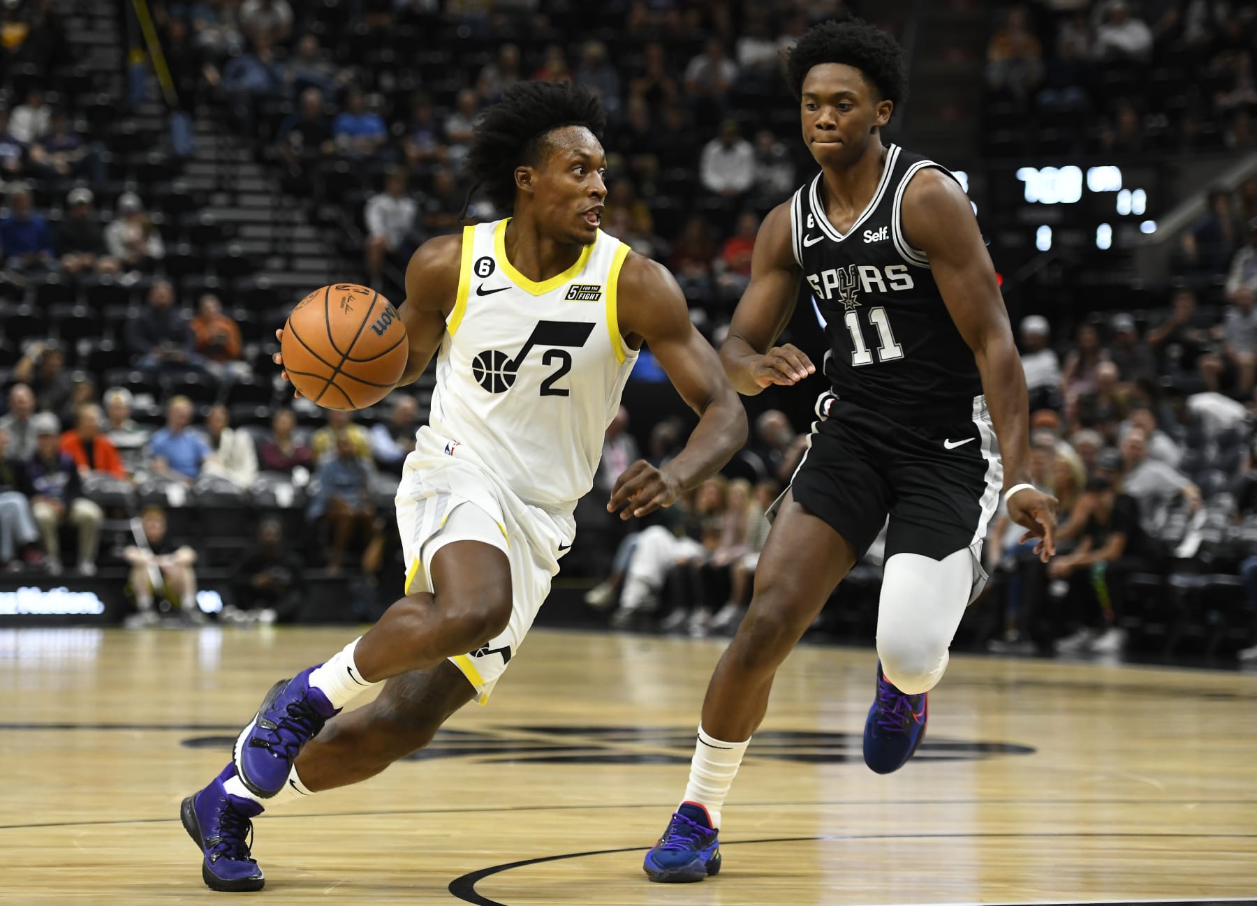 SALT LAKE CITY, UTAH - OCTOBER 11: Collin Sexton #2 of the Utah Jazz drives past Joshua Primo #11 of the San Antonio Spurs during a game at Vivint Arena on October 11, 2022 in Salt Lake City, Utah. NOTE TO USER: User expressly acknowledges and agrees that, by downloading and or using this photograph, User is consenting to the terms and conditions of the Getty Images License Agreement. (Photo by Alex Goodlett/Getty Images)