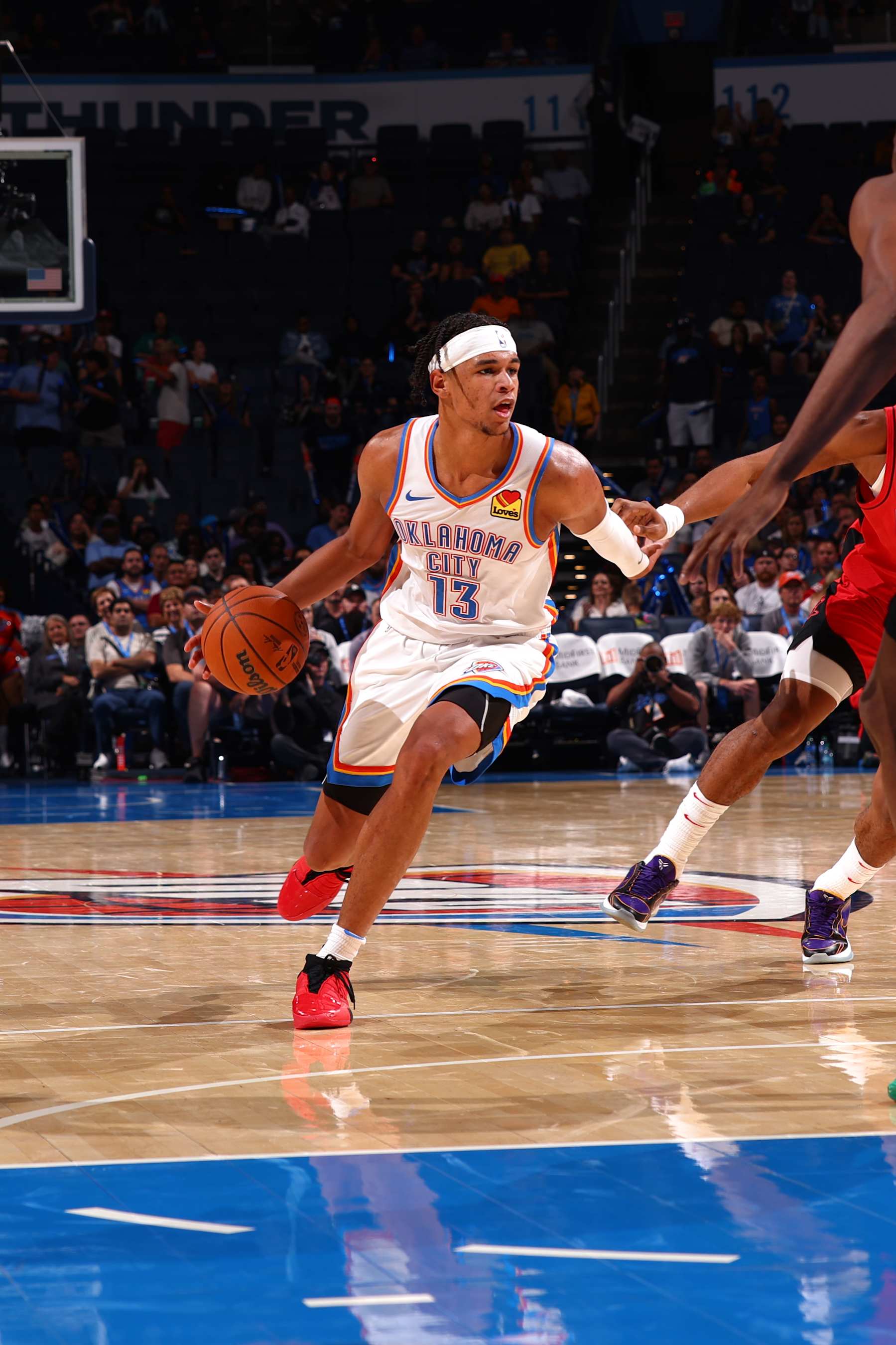 OKLAHOMA CITY, OK - OCTOBER 9: Ousmane Dieng #13 of the Oklahoma City Thunder dribbles the ball during the game against the Houston Rockets during a NBA pre season game on October 9, 2024 at Paycom Center in Oklahoma City, Oklahoma. NOTE TO USER: User expressly acknowledges and agrees that, by downloading and or using this photograph, User is consenting to the terms and conditions of the Getty Images License Agreement. Mandatory Copyright Notice: Copyright 2024 NBAE (Photo by Zach Beeker/NBAE via Getty Images)