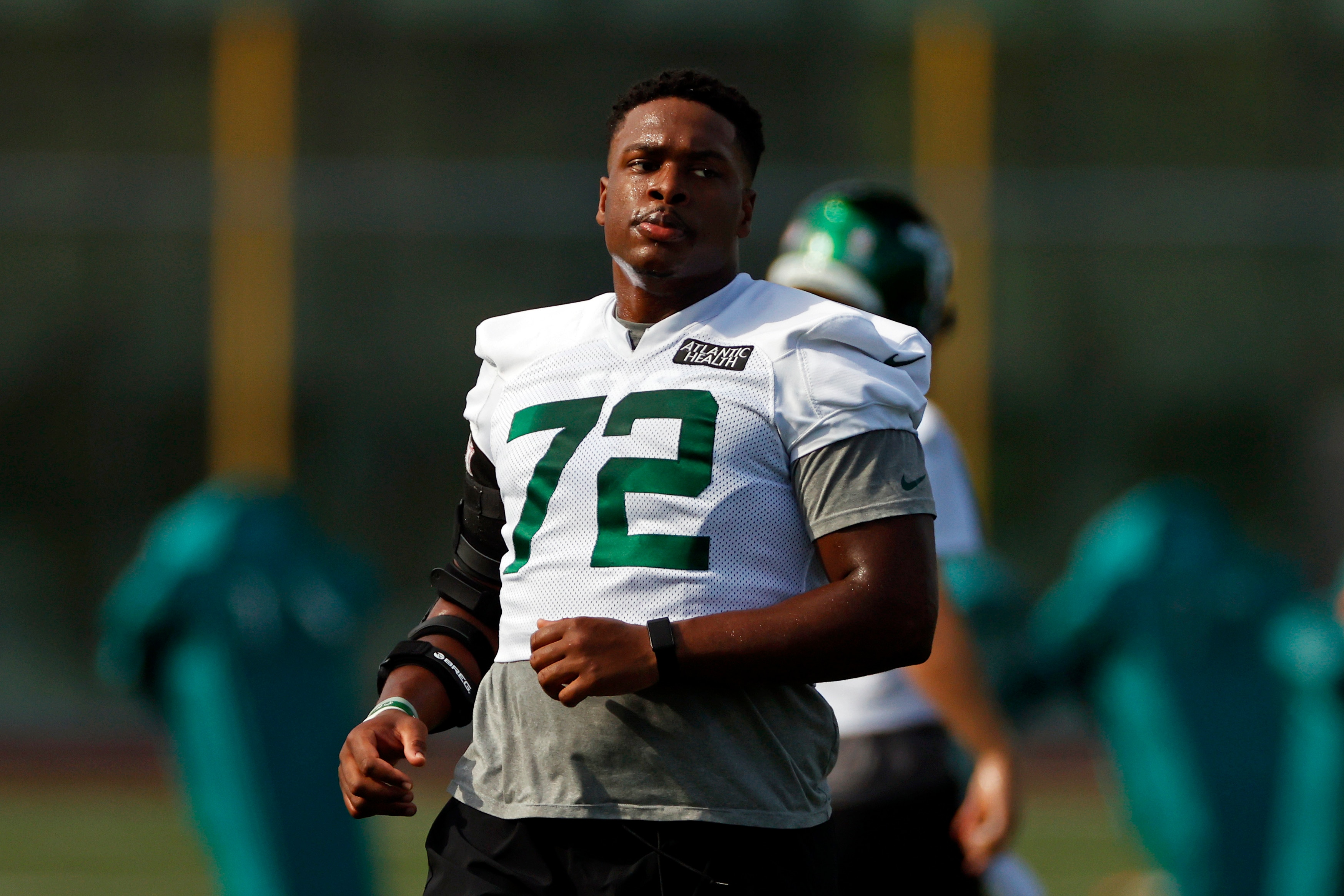 New York Jets offensive tackle Cameron Clark (72) during a practice at the NFL football team's training camp in Florham Park, N.J., Saturday, Aug. 22, 2020. (AP Photo/Adam Hunger)