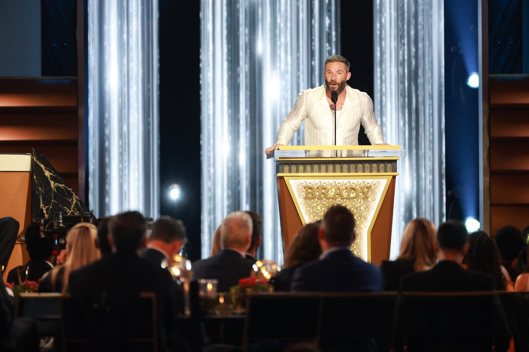 INGLEWOOD, CALIFORNIA - MAY 05: Julian Edelman speaks onstage during G.R.O.A.T The Greatest Roast Of All Time: Tom Brady for the Netflix is a Joke Festival at The Kia Forum on May 05, 2024 in Inglewood, California.  (Photo by Matt Winkelmeyer/Getty Images for Netflix)