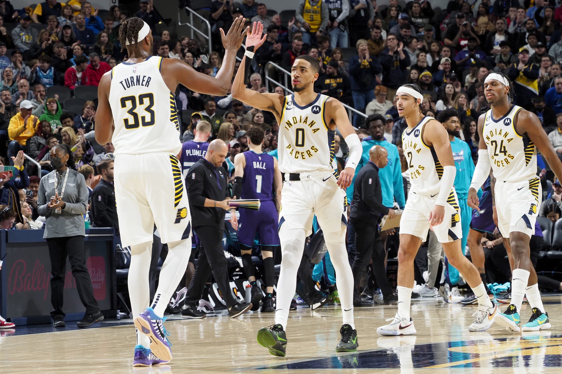 INDIANAPOLIS, IN - JANUARY 8: Myles Turner #33 of the Indiana Pacers high fives Tyrese Haliburton #0 during the game against the Charlotte Hornets on January 8, 2023 at Pan Am Plaza in Indianapolis, Indiana. NOTE TO USER: User expressly acknowledges and agrees that, by downloading and or using this Photograph, user is consenting to the terms and conditions of the Getty Images License Agreement. Mandatory Copyright Notice: Copyright 2023 NBAE (Photo by Ron Hoskins/NBAE via Getty Images)
