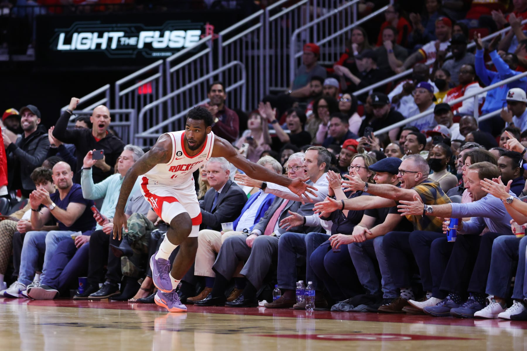 HOUSTON, TEXAS - DECEMBER 05: Tari Eason #17 of the Houston Rockets reacts to a basket against the Philadelphia 76ers during the second half at Toyota Center on December 05, 2022 in Houston, Texas. NOTE TO USER: User expressly acknowledges and agrees that, by downloading and or using this photograph, User is consenting to the terms and conditions of the Getty Images License Agreement. (Photo by Carmen Mandato/Getty Images)