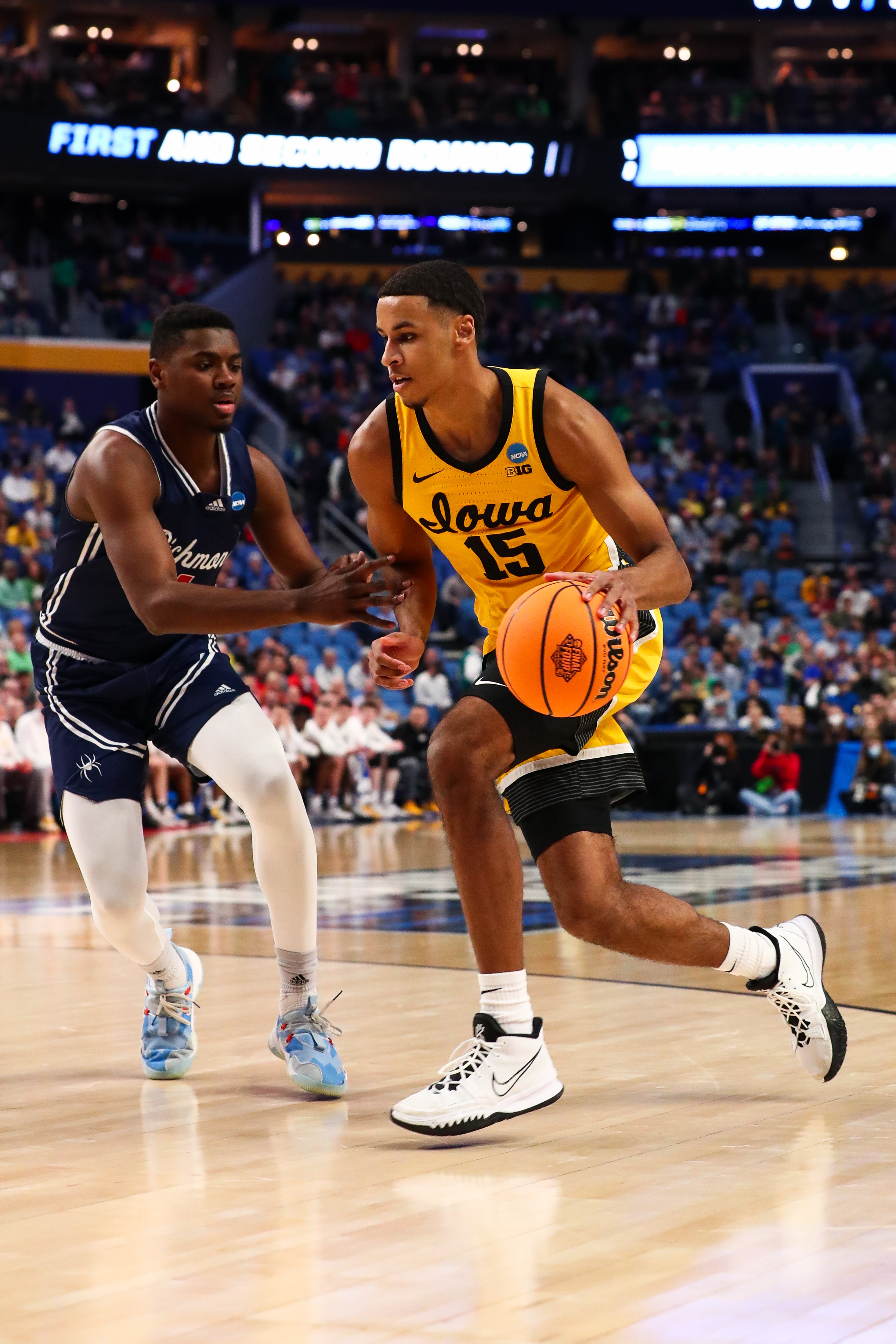 BUFFALO, NY - MARCH 17: Keegan Murray #15 of the Iowa Hawkeyes dribbles against Nathan Cayo #4 of the Richmond Spiders during the first round of the 2022 NCAA Men's Basketball Tournament held at the KeyBank Center on March 17, 2022 in Buffalo, New York. (Photo by Bill Wippert/NCAA Photos via Getty Images)