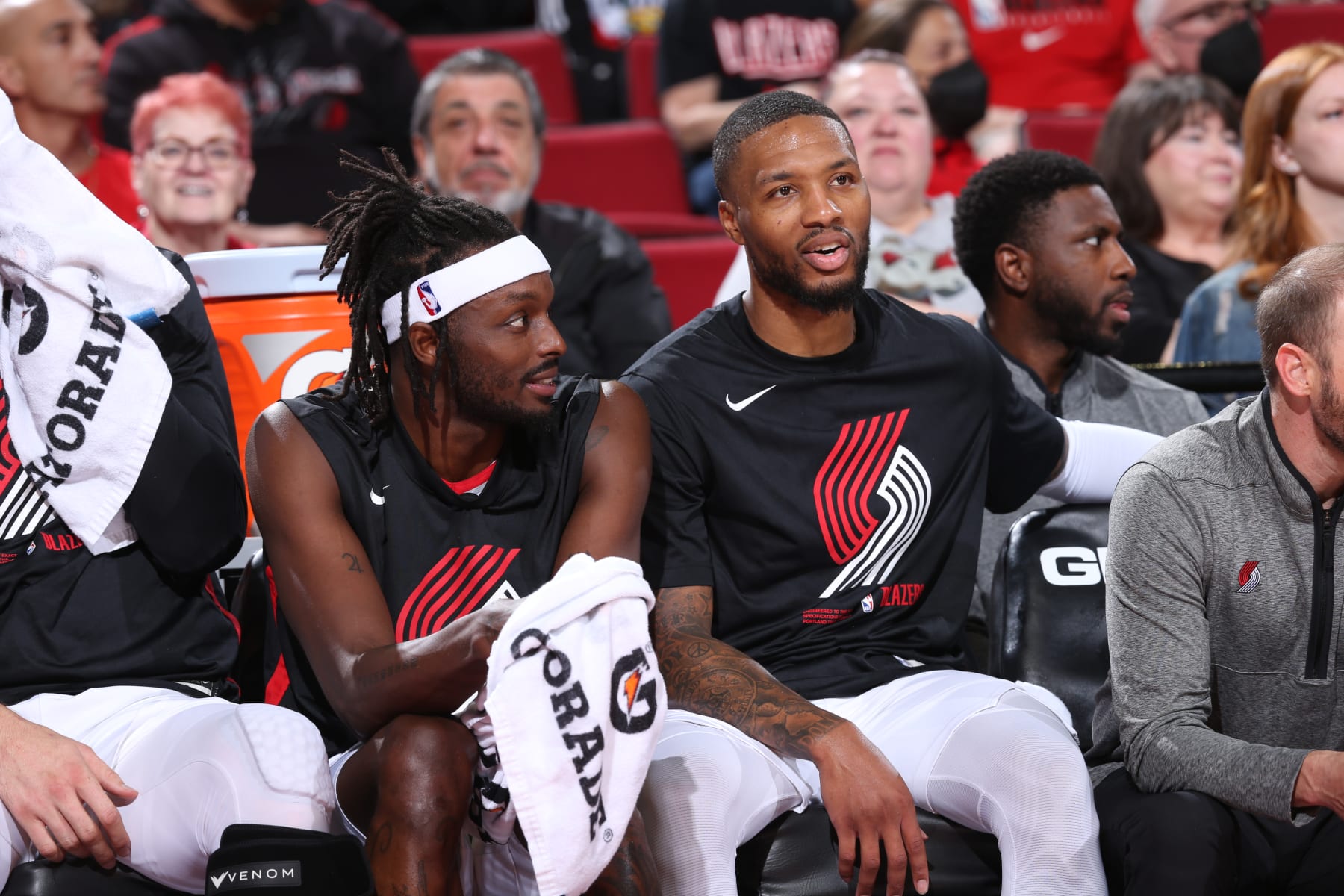 PORTLAND, OR - OCTOBER 4: Jerami Grant #9 of the Portland Trail Blazers talks with Damian Lillard #0 of the Portland Trail Blazers during a preseason game on October 4, 2022 at the Moda Center Arena in Portland, Oregon. NOTE TO USER: User expressly acknowledges and agrees that, by downloading and or using this photograph, user is consenting to the terms and conditions of the Getty Images License Agreement. Mandatory Copyright Notice: Copyright 2022 NBAE (Photo by Sam Forencich/NBAE via Getty Images)