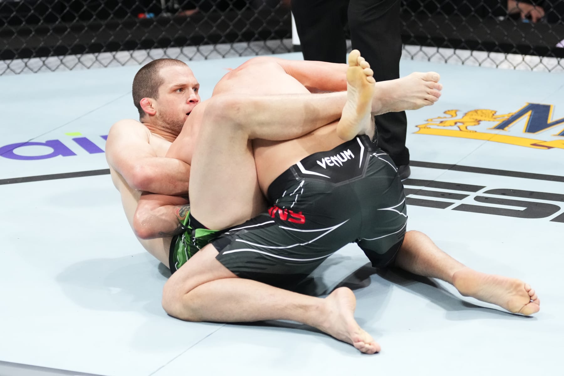 CHARLOTTE, NORTH CAROLINA - MAY 13:  (L-R) Alex Morono submits Tim Means in their welterweight fight during the UFC Fight Night event at Spectrum Center on May 13, 2023 in Charlotte, North Carolina. (Photo by Jeff Bottari/Zuffa LLC via Getty Images)