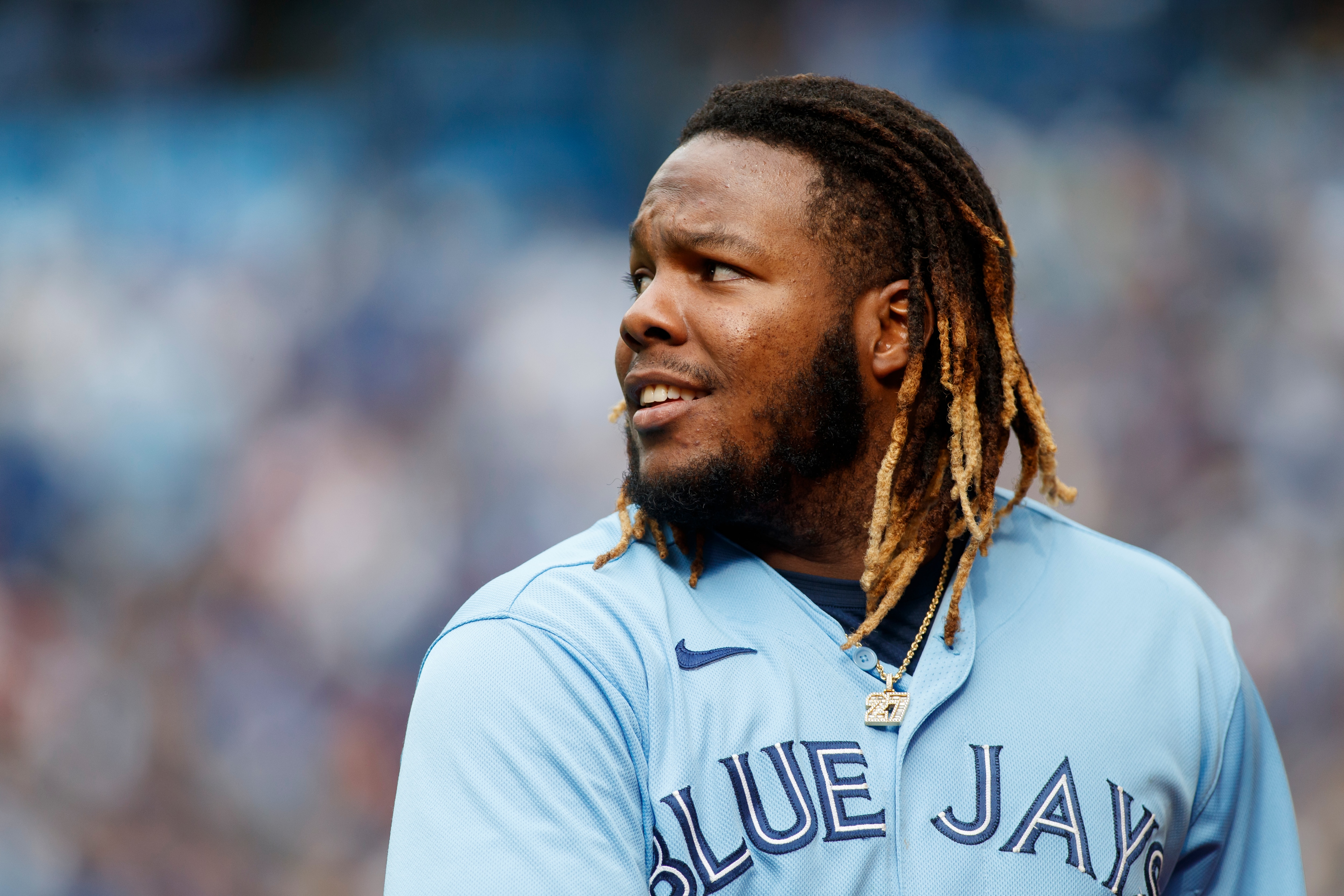 TORONTO, ON - JULY 31: Vladimir Guerrero Jr. #27 of the Toronto Blue Jays walks to the dugout during their MLB game against the Kansas City Royals at Rogers Centre on July 31, 2021 in Toronto, Ontario. (Photo by Cole Burston/Getty Images)