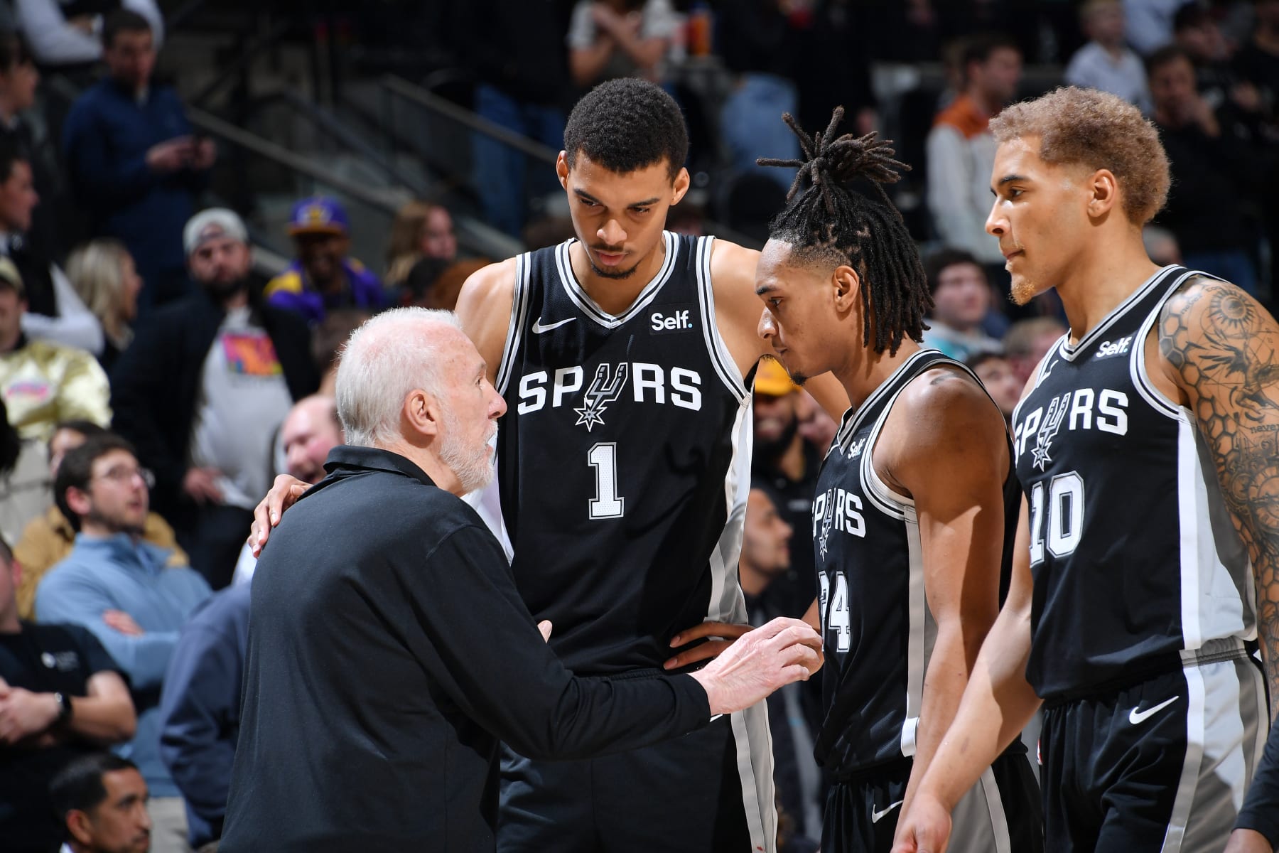 Spurs head coach Gregg Popovich, Victor Wembanyama, Devin Vassell and Jeremy Sochan