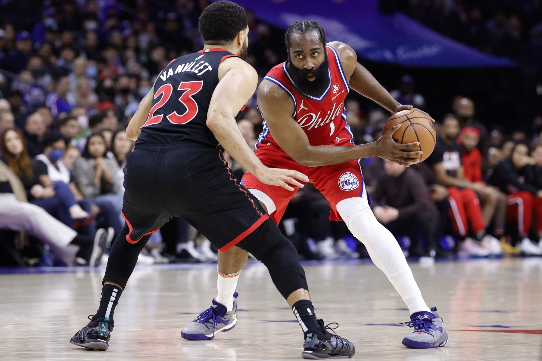 PHILADELPHIA, PENNSYLVANIA - APRIL 18: James Harden #1 of the Philadelphia 76ers looks on past Fred VanVleet #23 of the Toronto Raptors during Game Two of the Eastern Conference First Round at Wells Fargo Center on April 18, 2022 in Philadelphia, Pennsylvania. NOTE TO USER: User expressly acknowledges and agrees that, by downloading and or using this photograph, User is consenting to the terms and conditions of the Getty Images License Agreement. (Photo by Tim Nwachukwu/Getty Images)