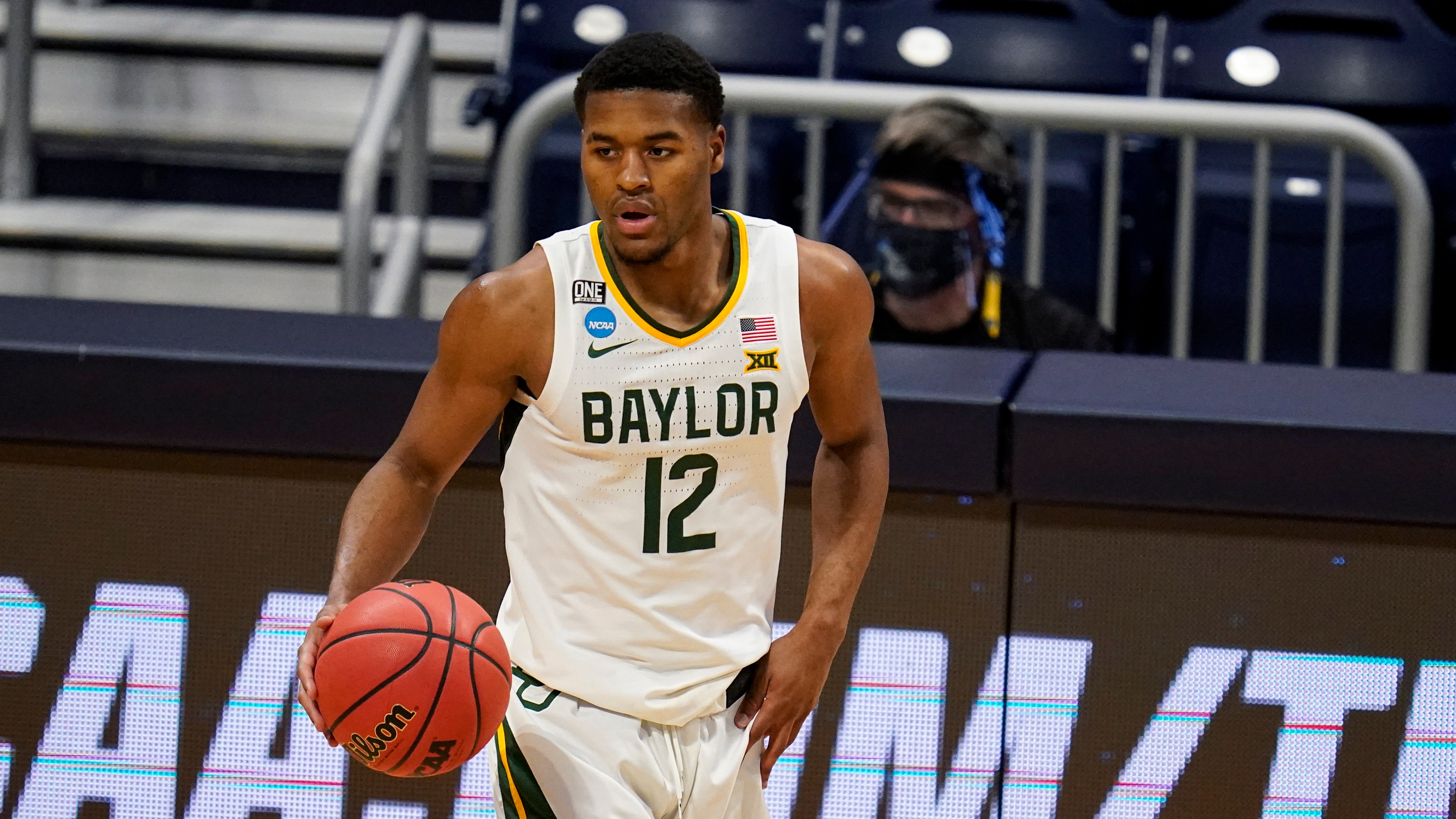 Baylor guard Jared Butler (12) plays against Wisconsin in the second half of a second-round game in the NCAA men's college basketball tournament at Hinkle Fieldhouse in Indianapolis, Sunday, March 21, 2021. (AP Photo/Michael Conroy)