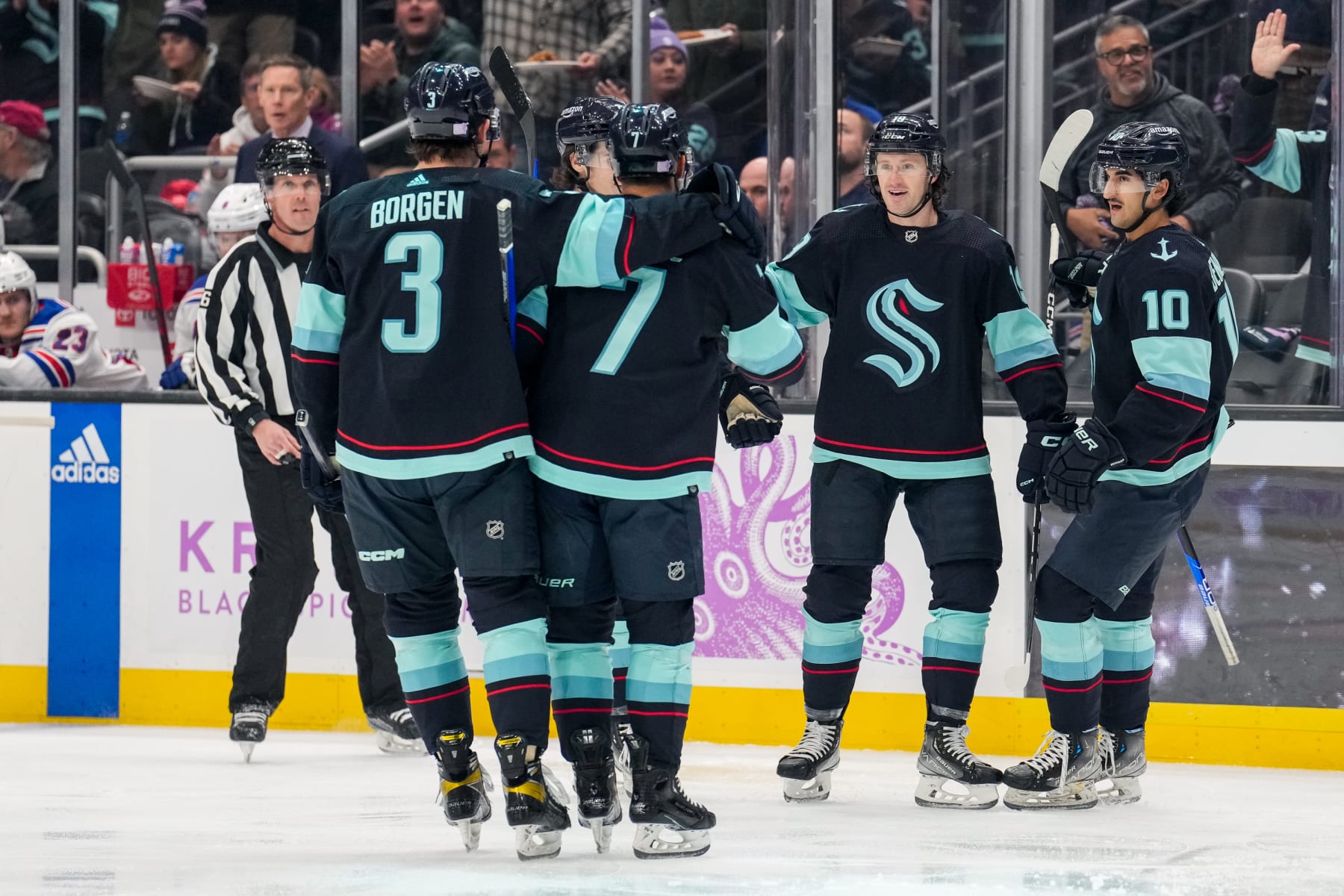 SEATTLE, WASHINGTON - NOVEMBER 17: Will Borgen #3, Jordan Eberle #7, Jared McCann #19 and Matty Beniers #10 of the Seattle Kraken celebrate McCanns goal during the first period of a game against the New York Rangers at Climate Pledge Arena on November 17, 2022 in Seattle, Washington. (Photo by Christopher Mast/NHLI via Getty Images)