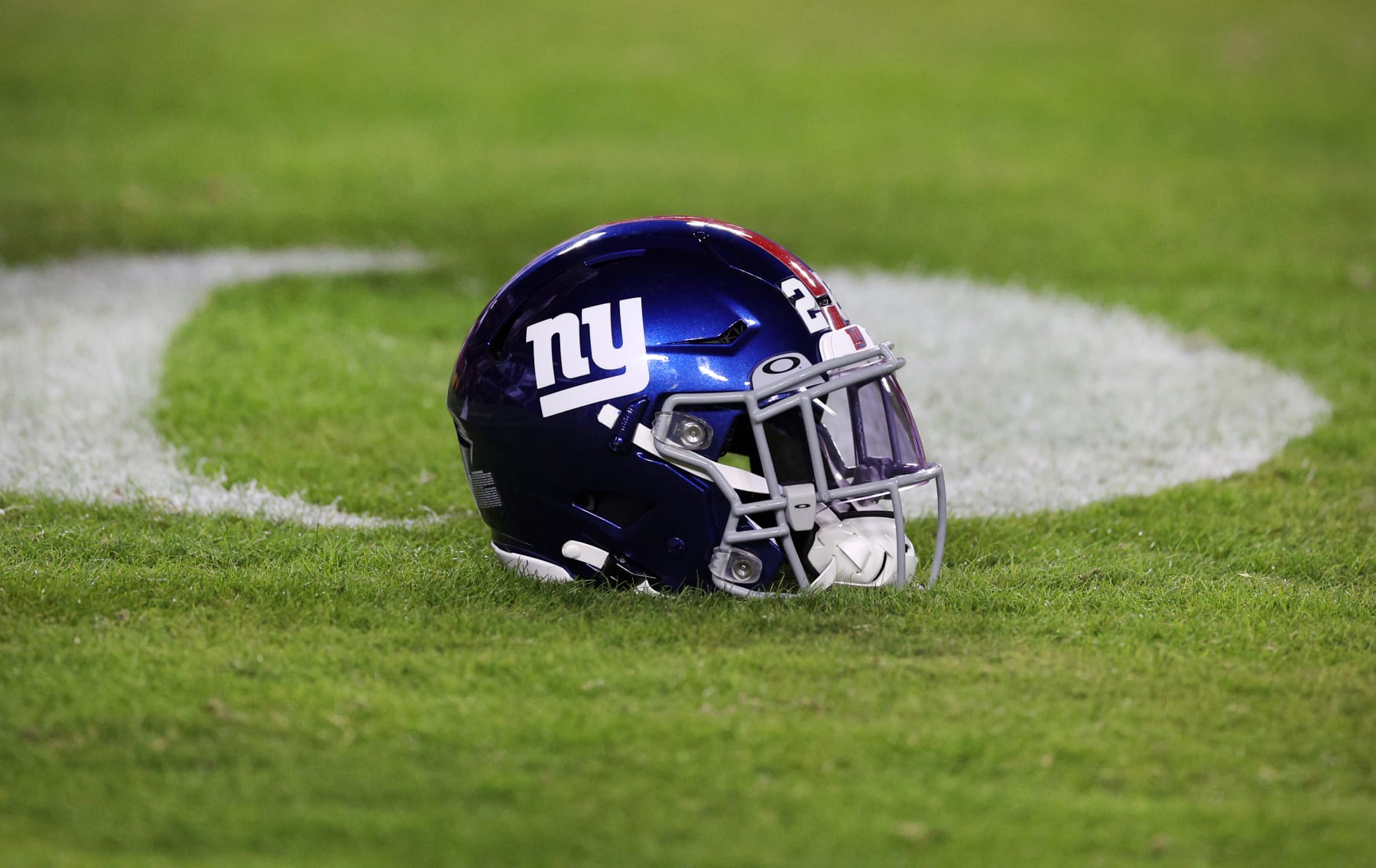 LANDOVER, MARYLAND - DECEMBER 18: A New York Giants helmet sits on the field prior to the start of the game against the Washington Commanders at FedExField on December 18, 2022 in Landover, Maryland. (Photo by Rob Carr/Getty Images)