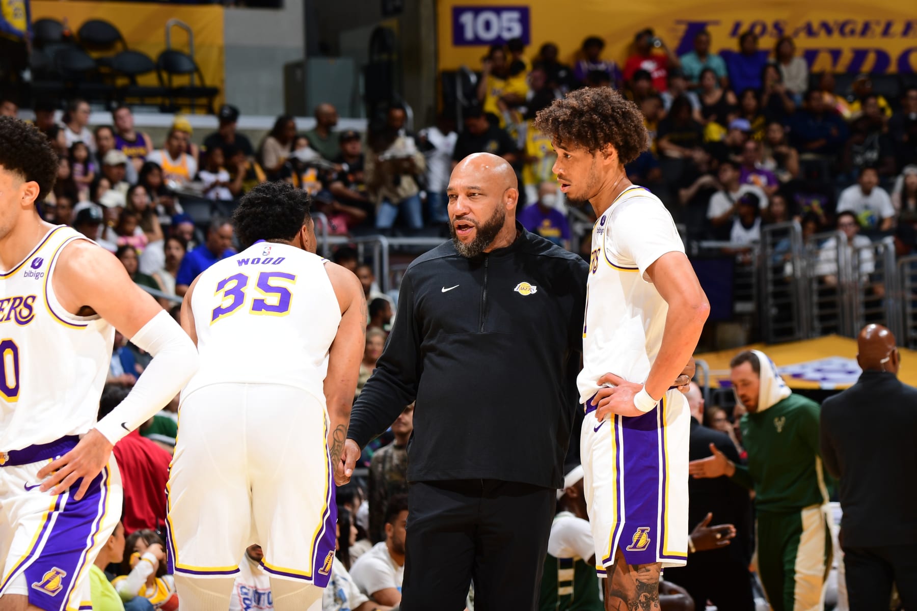 LOS ANGELES, CA - OCTOBER 15: Head Coach Darvin Ham talks to Christian Wood #35 and Jaxson Hayes #11  of the Los Angeles Lakers during the game against the Milwaukee Bucks on October 15, 2023 at Crypto.Com Arena in Los Angeles, California. NOTE TO USER: User expressly acknowledges and agrees that, by downloading and/or using this Photograph, user is consenting to the terms and conditions of the Getty Images License Agreement. Mandatory Copyright Notice: Copyright 2023 NBAE (Photo by Adam Pantozzi/NBAE via Getty Images)