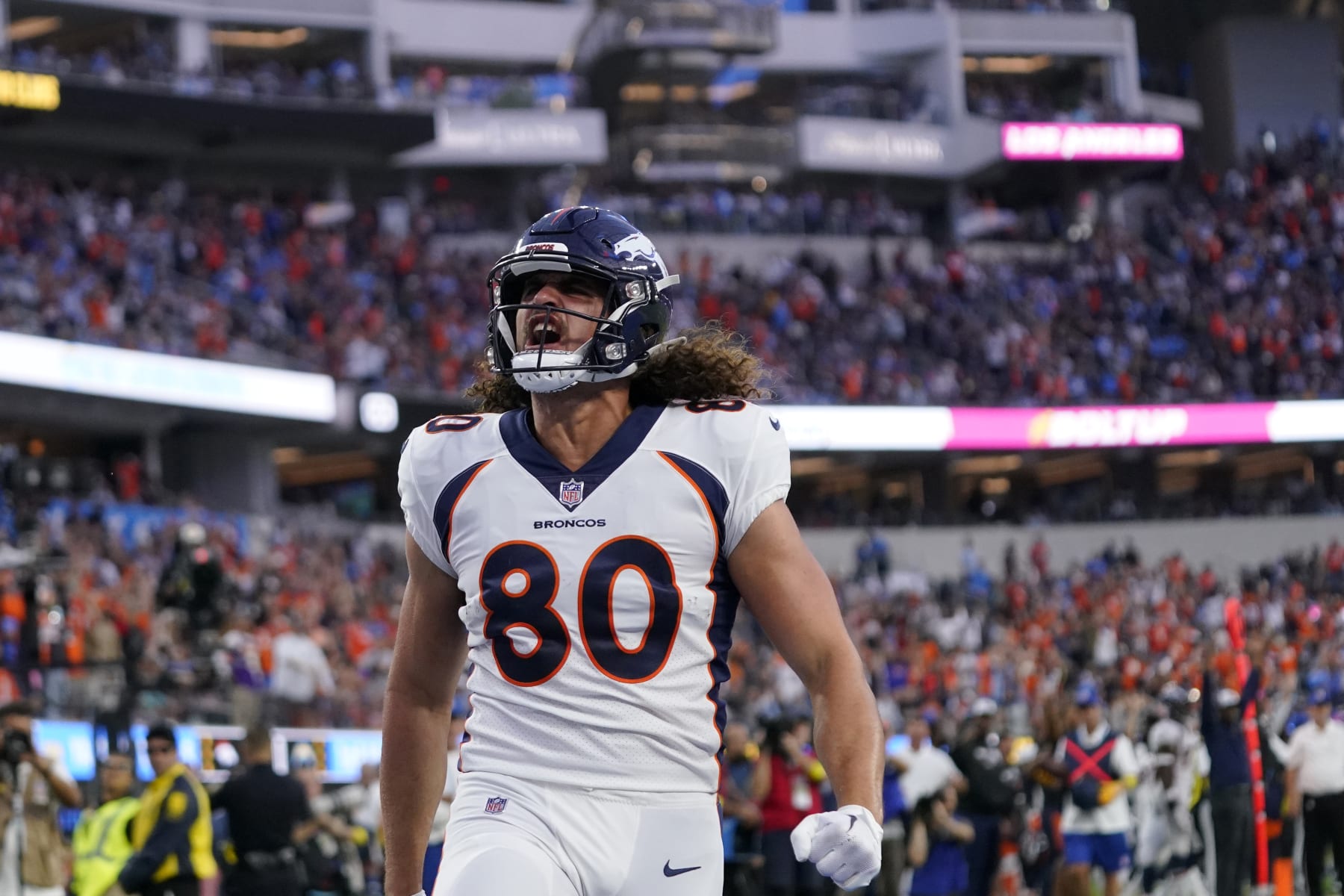 Denver Broncos tight end Greg Dulcich (80) celebrates his touchdown catch against the Los Angeles Chargers during the first half of an NFL football game, Monday, Oct. 17, 2022, in Inglewood, Calif. (AP Photo/Mark J. Terrill)