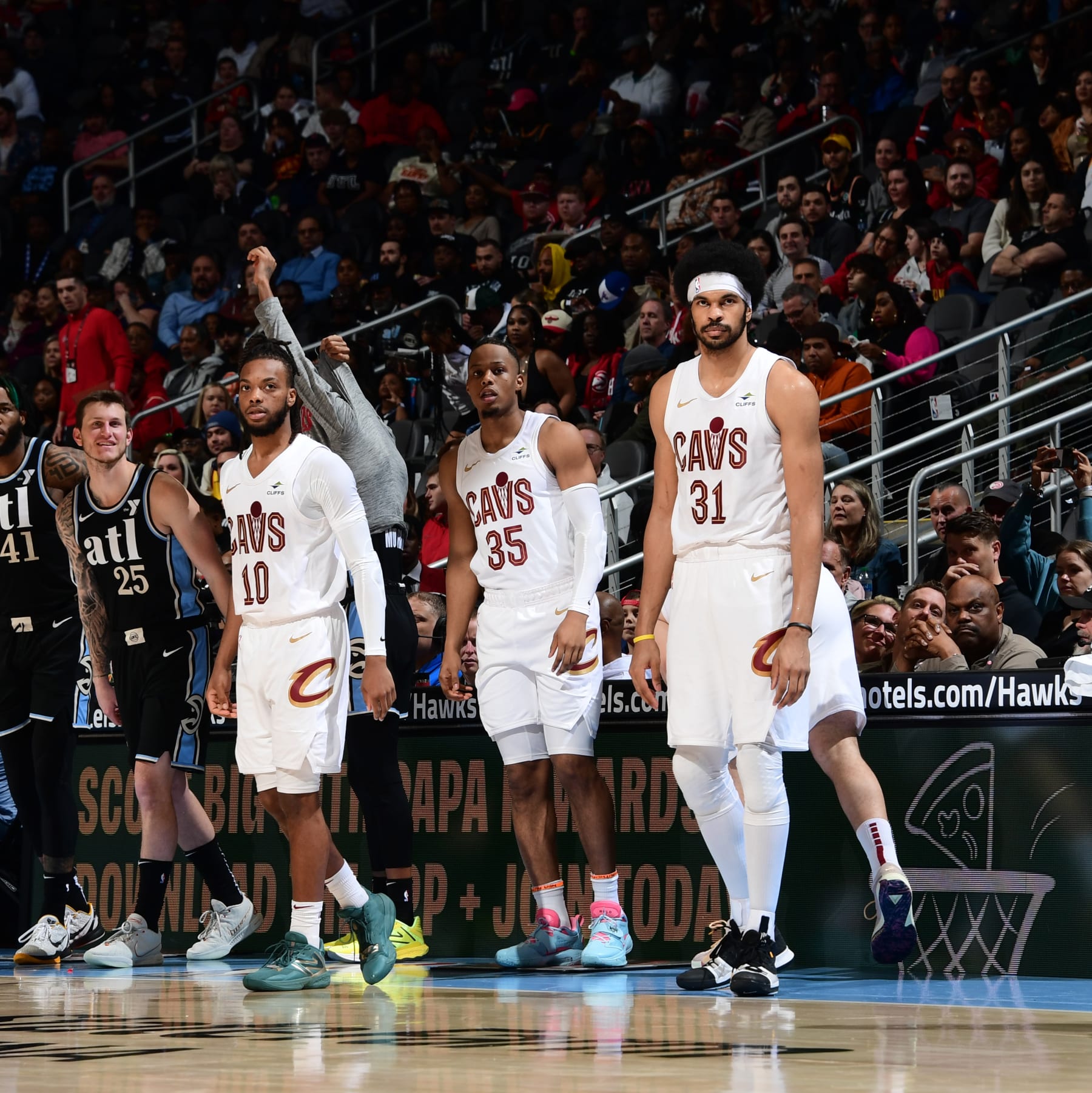 Darius Garland, Isaac Okoro and Jarrett Allen
