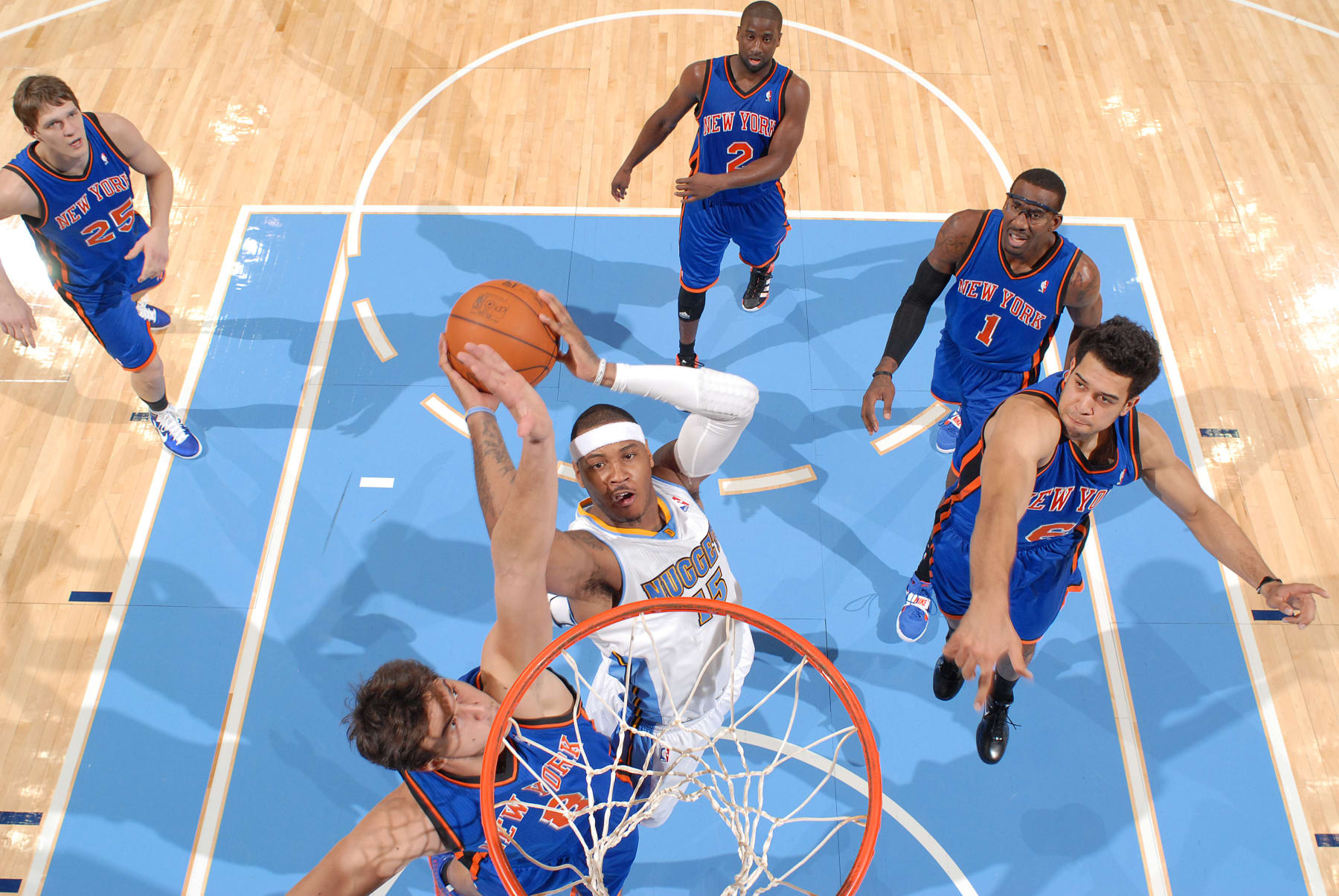 DENVER - NOVEMBER 16: Carmelo Anthony #15 of the Denver Nuggets goes to the basket against Danilo Gallinari #8 of the New York Knicks on November 16, 2010 at the Pepsi Center in Denver, Colorado. NOTE TO USER: User expressly acknowledges and agrees that, by downloading and/or using this Photograph, user is consenting to the terms and conditions of the Getty Images License Agreement. Mandatory Copyright Notice: Copyright 2010 NBAE (Photo by Garrett W. Ellwood/NBAE via Getty Images)