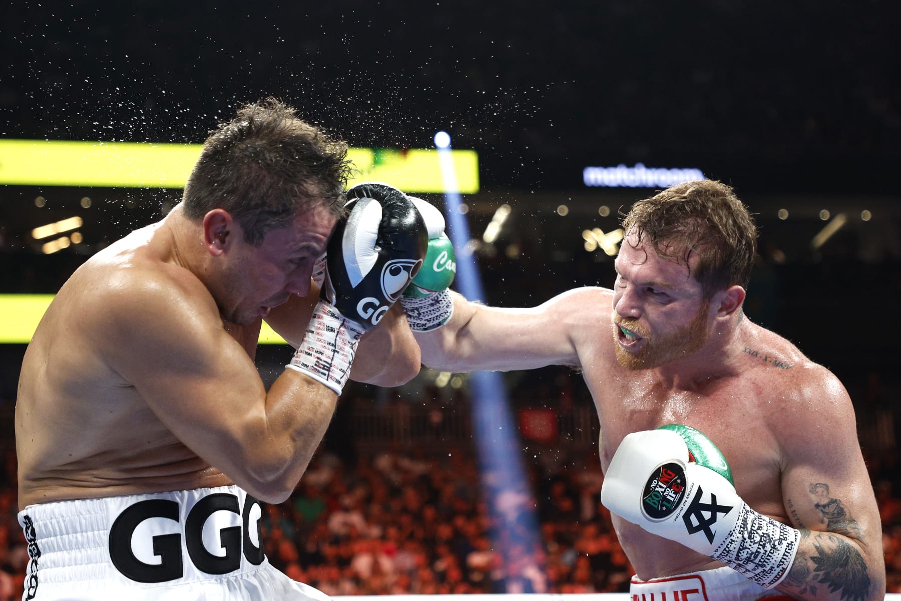 LAS VEGAS, NEVADA - SEPTEMBER 17: Canelo Alvarez (red trunks) lands a punch against Gennadiy Golovkin (white trunks) in round five of the fight for the Super Middleweight Title at T-Mobile Arena on September 17, 2022 in Las Vegas, Nevada. (Photo by Sarah Stier/Getty Images)