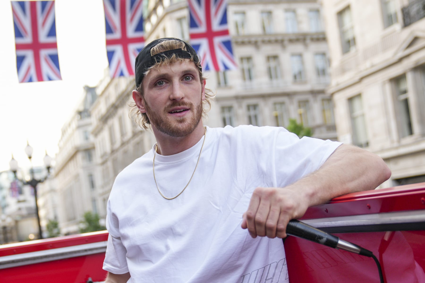 Logan Paul promotes an energy drink whilst on an open top bus traveling through London, Friday, June 17, 2022. (AP Photo/Scott Garfitt)