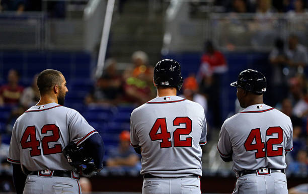 MIAMI, FL - APRIL 15: Members outfield the Atlanta Braves look on during a game against the Miami Marlins at Marlins Park on April 15, 2016 in Miami, Florida. All players are wearing #42 in honor of Jackie Robinson Day.  (Photo by Mike Ehrmann/Getty Images)