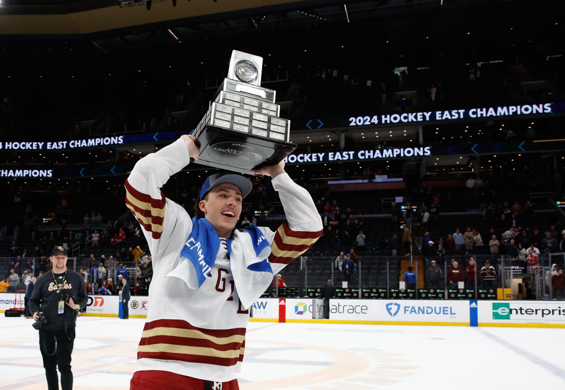 BOSTON, MASSACHUSETTS - MARCH 23: Gabe Perreault #34 of the Boston College Eagles celebrates with the Lamoriello Trophy after winning the Hockey East championship after a win against the Boston University Terriers during the Hockey East Championship final at TD Garden on March 23, 2024 in Boston, Massachusetts. The Eagles won 6-2 and captured their first Hockey East title in twelve years. (Photo by Richard T Gagnon/Getty Images)