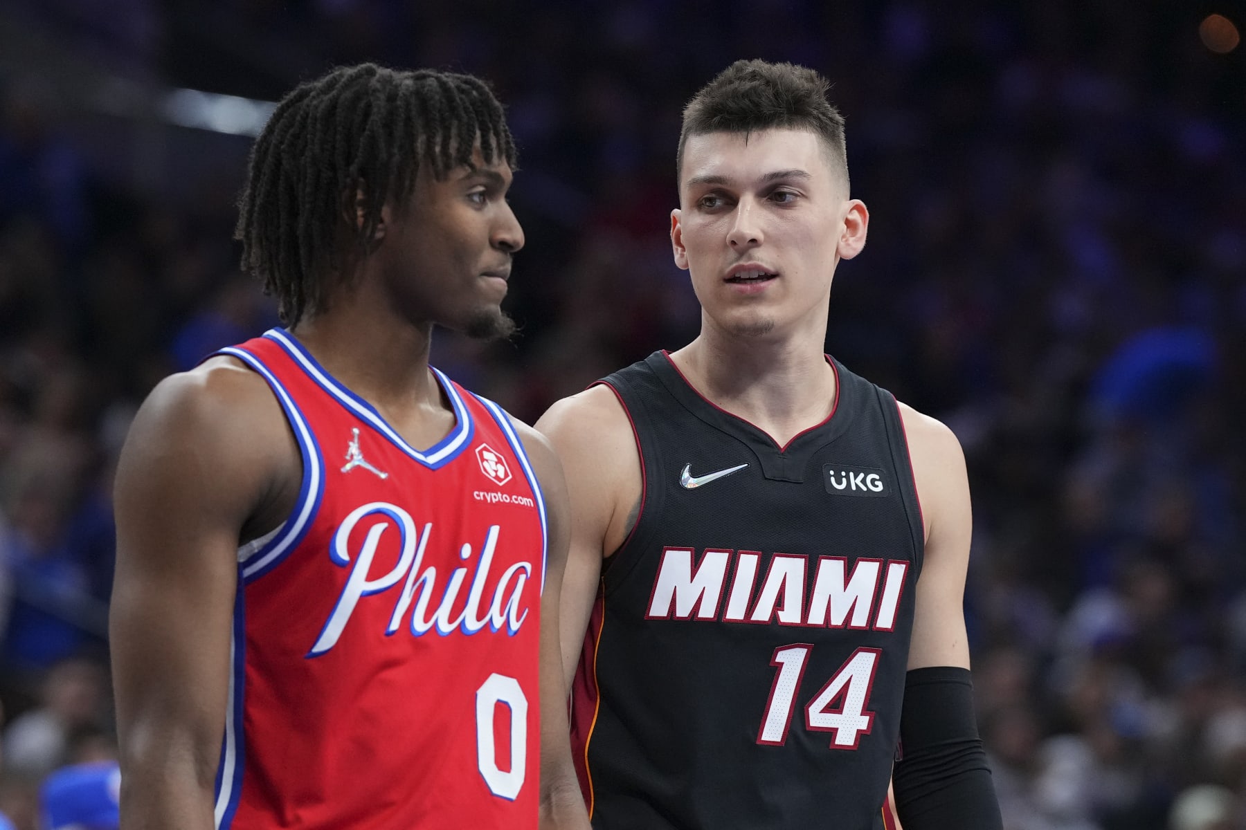 PHILADELPHIA, PA - MAY 08: Tyrese Maxey #0 of the Philadelphia 76ers talks to Tyler Herro #14 of the Miami Heat during Game Four of the 2022 NBA Playoffs Eastern Conference Semifinals at the Wells Fargo Center on May 8, 2022 in Philadelphia, Pennsylvania. The 76ers defeated the Heat 116-108. NOTE TO USER: User expressly acknowledges and agrees that, by downloading and or using this photograph, User is consenting to the terms and conditions of the Getty Images License Agreement. (Photo by Mitchell Leff/Getty Images)