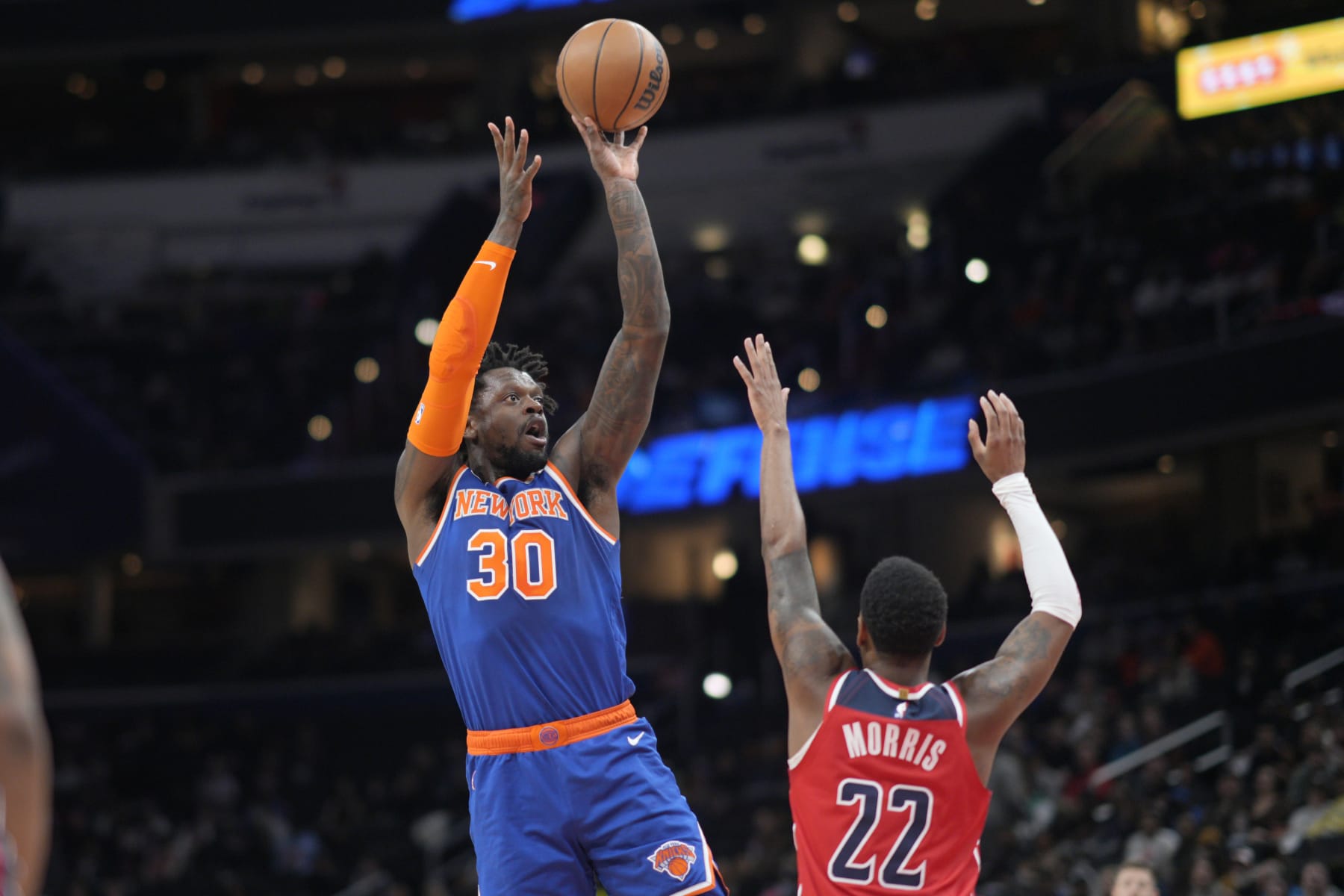 WASHINGTON, DC - FEBRUARY 24: Julius Randle #30 of the New York Knicks shoots over Monte Morris #22 of the Washington Wizards during the first half at Capital One Arena on February 24, 2023 in Washington, DC. NOTE TO USER: User expressly acknowledges and agrees that, by downloading and or using this photograph, User is consenting to the terms and conditions of the Getty Images License Agreement. (Photo by Jess Rapfogel/Getty Images)