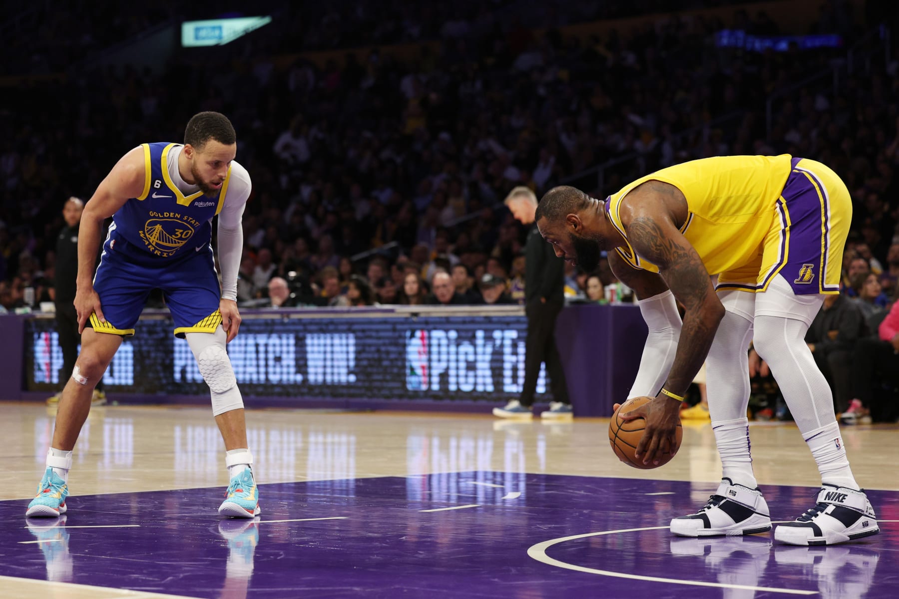 LOS ANGELES, CALIFORNIA - MAY 12: LeBron James #6 of the Los Angeles Lakers picks up the ball in front of Stephen Curry #30 of the Golden State Warriors during the third quarter in game six of the Western Conference Semifinal Playoffs at Crypto.com Arena on May 12, 2023 in Los Angeles, California. NOTE TO USER: User expressly acknowledges and agrees that, by downloading and or using this photograph, User is consenting to the terms and conditions of the Getty Images License Agreement. (Photo by Harry How/Getty Images)
