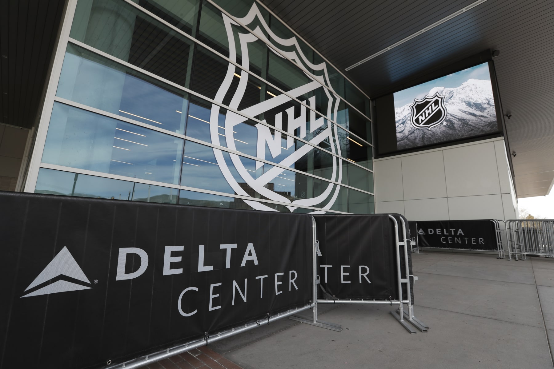 SALT LAKE CITY, UT - APRIL 19: NHL logos are seen on the Delta Center windows on April 19, 2024 in Salt Lake City, Utah. The NHL has allowed the sale of the Arizona Coyotes and the team will relocate to Salt Lake City, Utah. (Photo by Chris Gardner/Getty Images)