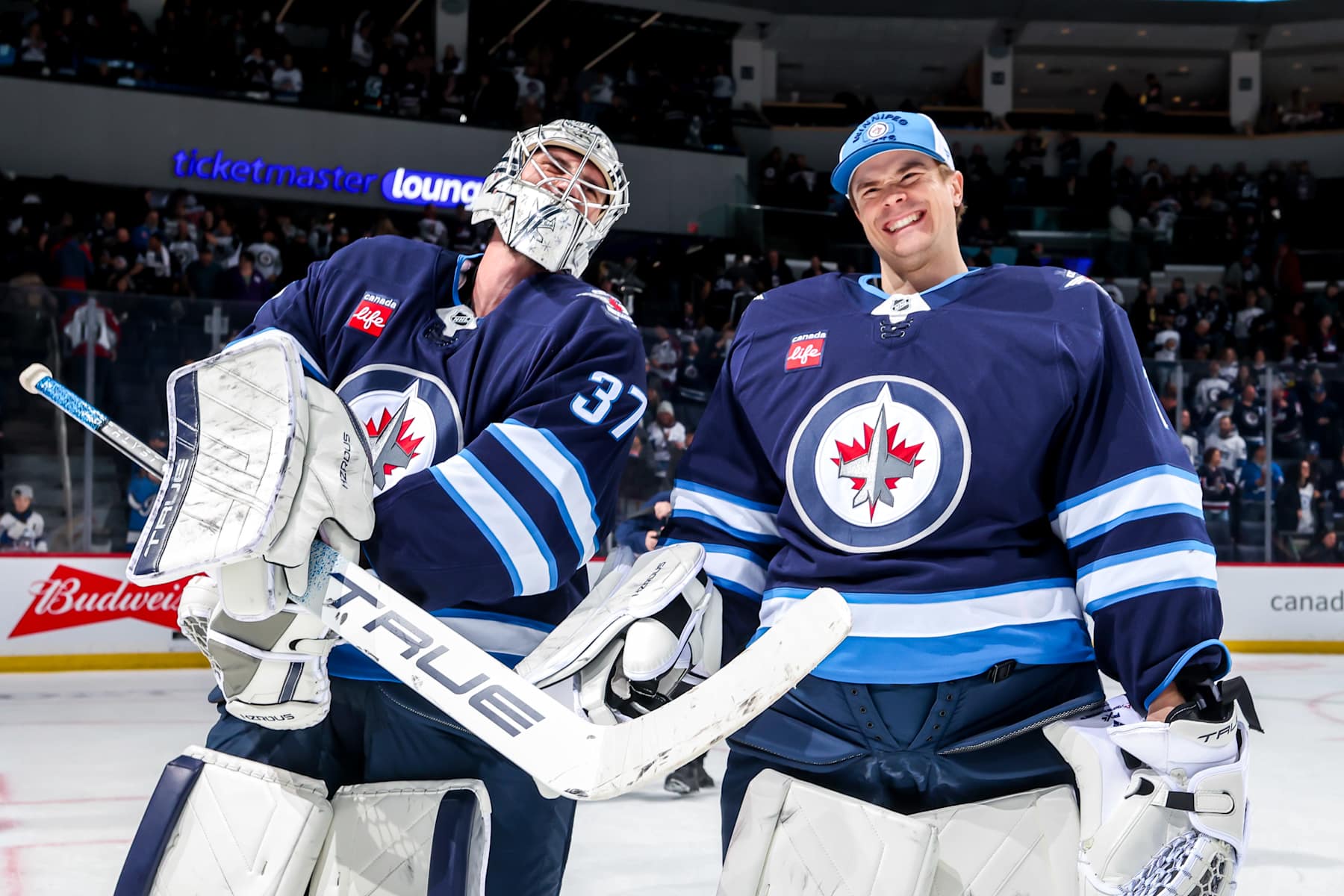 Connor Hellebuyck and Eric Comrie.