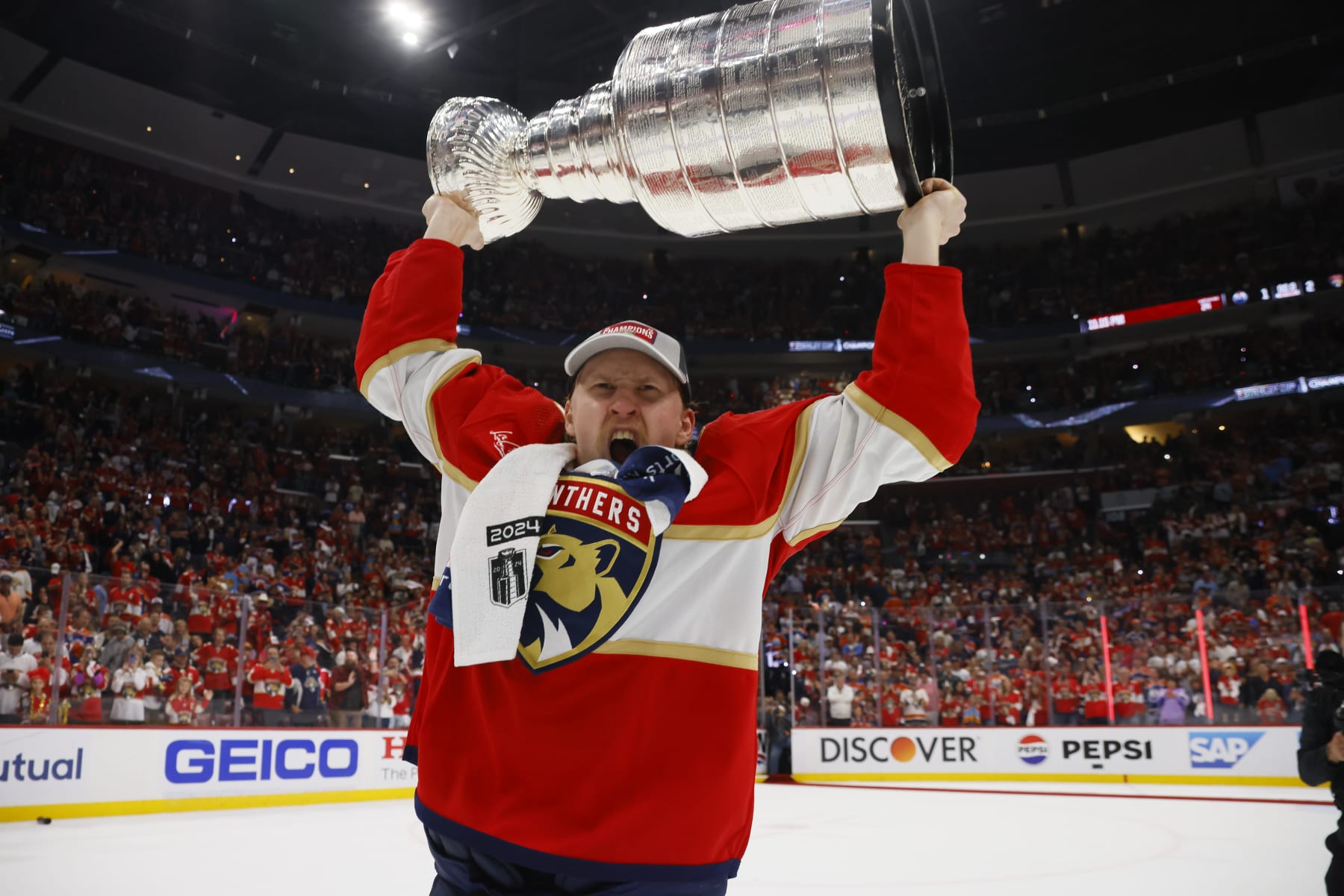 SUNRISE, FLORIDA - JUNE 24: Niko Mikkola #77 of the Florida Panthers celebrates with the Stanley Cup following a 2-1 victory over the Edmonton Oilers in Game Seven of the 2024 NHL Stanley Cup Final at Amerant Bank Arena on June 24, 2024 in Sunrise, Florida. (Photo by Bruce Bennett/Getty Images)