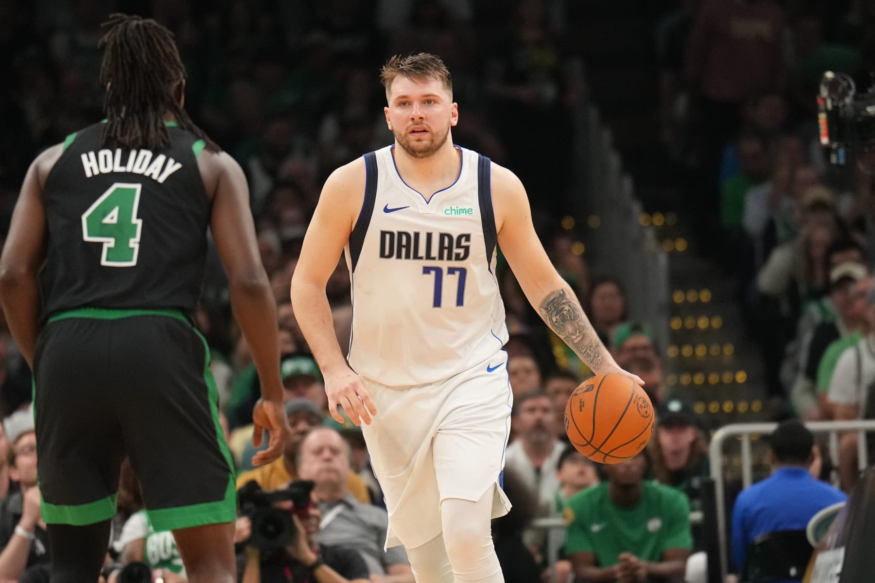 Jrue Holiday and Luka DonÄiÄ
