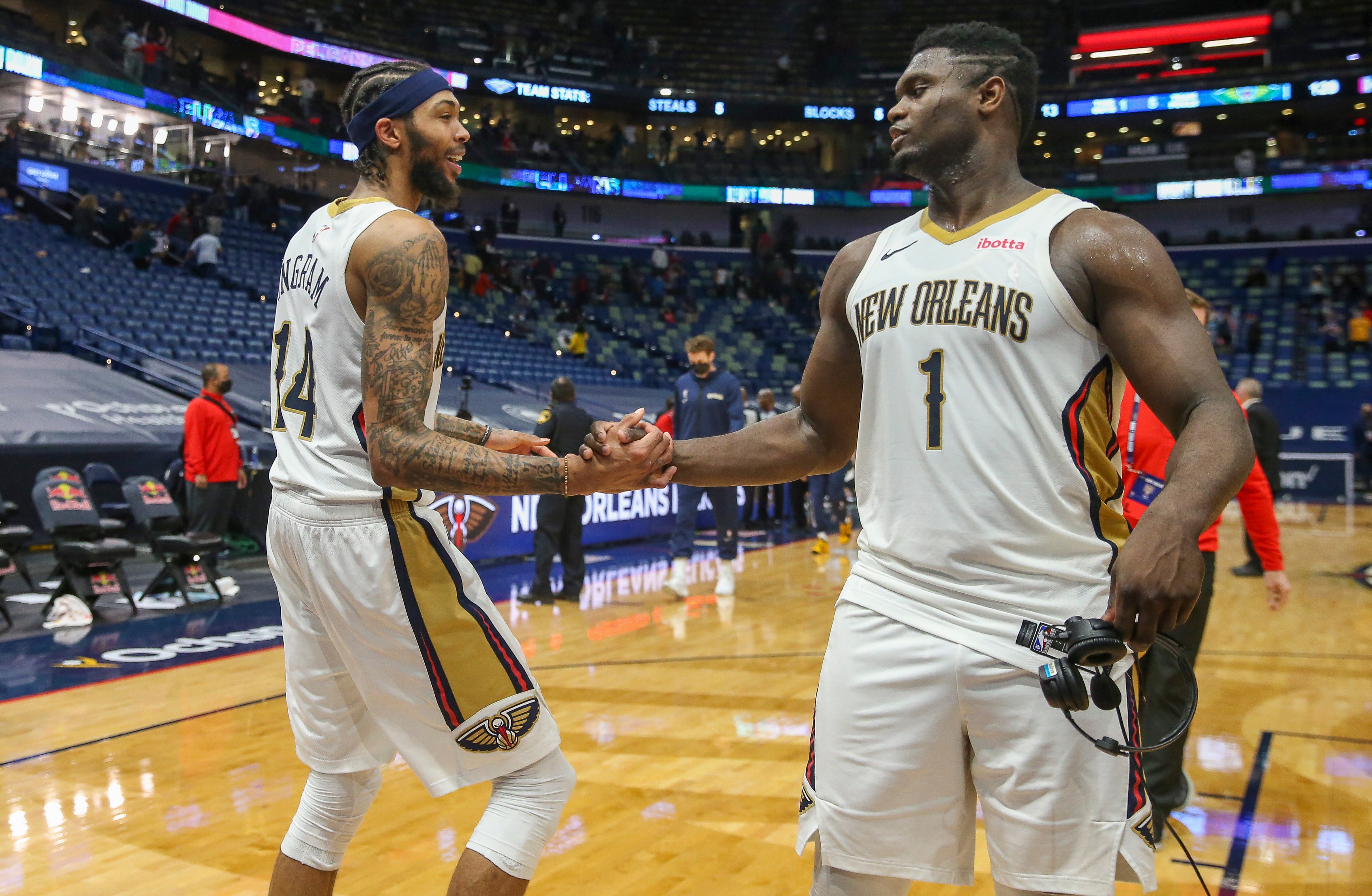 NEW ORLEANS, LA - MARCH 1: Brandon Ingram #14 and Zion Williamson #1 of the New Orleans Pelicans hi-five after a game against the Utah Jazz on March 1, 2021 at the Smoothie King Center in New Orleans, Louisiana. NOTE TO USER: User expressly acknowledges and agrees that, by downloading and or using this Photograph, user is consenting to the terms and conditions of the Getty Images License Agreement. Mandatory Copyright Notice: Copyright 2021 NBAE (Photo by Layne Murdoch Jr./NBAE via Getty Images)