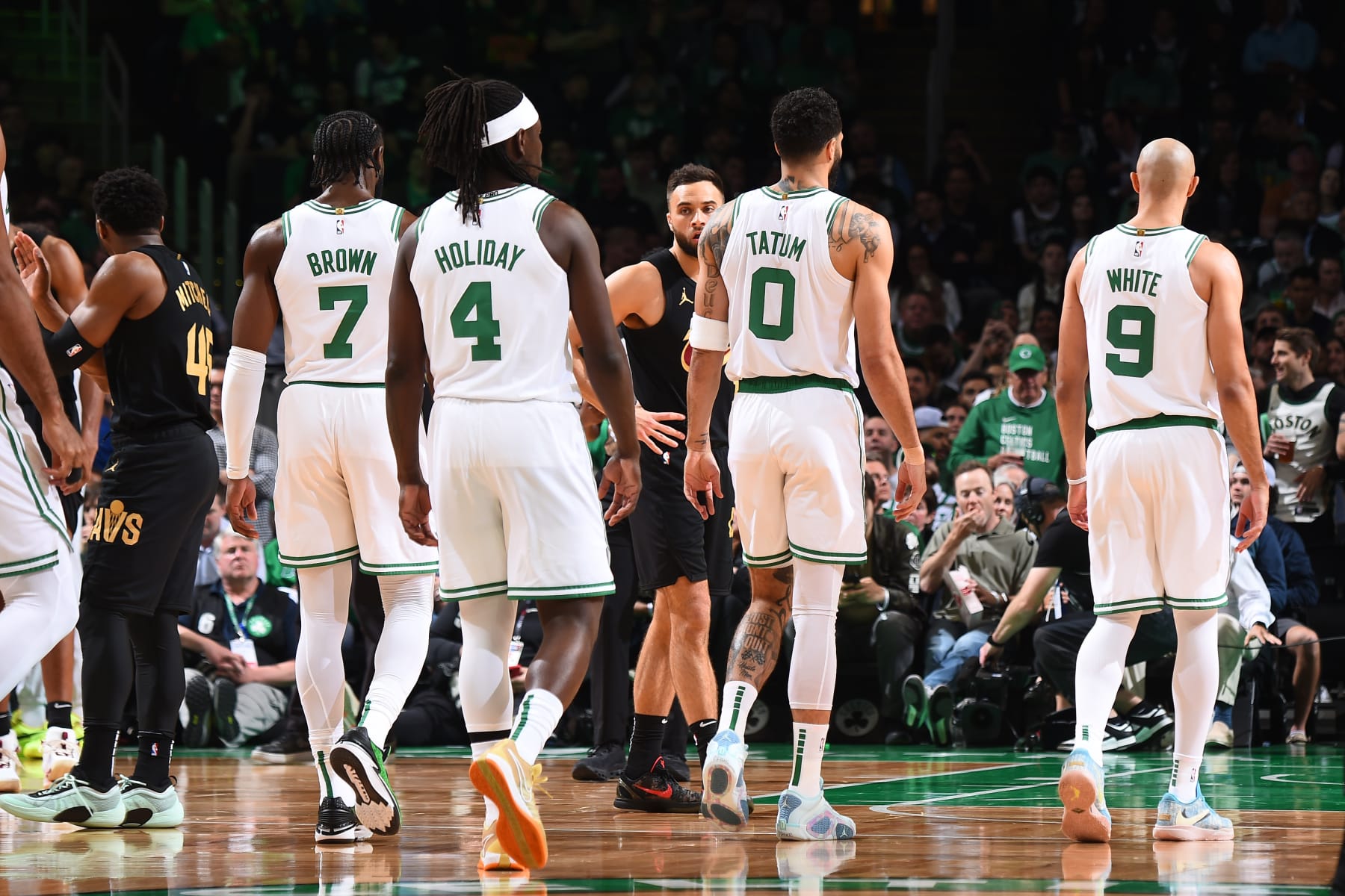 BOSTON, MA - MAY 7: Jaylen Brown #7, Jrue Holiday #4, Jayson Tatum #0, and Derrick White #9 of the Boston Celtics looks on during the game against the Cleveland Cavaliers during Round 2 Game 1 on May 7, 2024 at the TD Garden in Boston, Massachusetts. NOTE TO USER: User expressly acknowledges and agrees that, by downloading and or using this photograph, User is consenting to the terms and conditions of the Getty Images License Agreement. Mandatory Copyright Notice: Copyright 2024 NBAE  (Photo by Brian Babineau/NBAE via Getty Images)